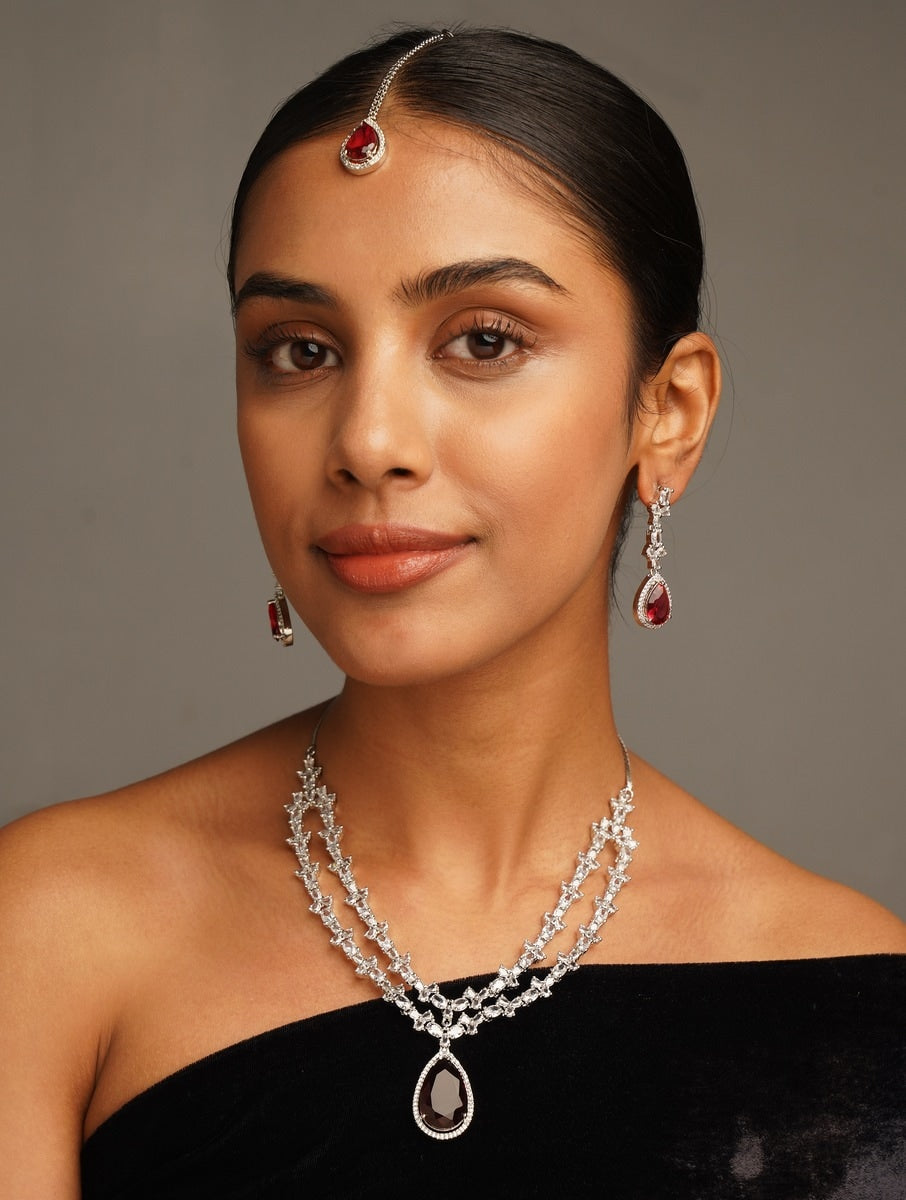 Silver Plated American Diamond Necklace Set with matching earrings and maang tikka worn by woman