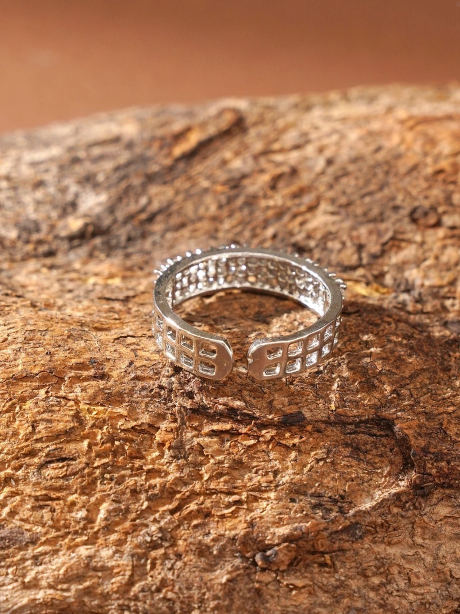 Abdesignsjewellery silver plated American diamond ring open band with square stone settings on wood