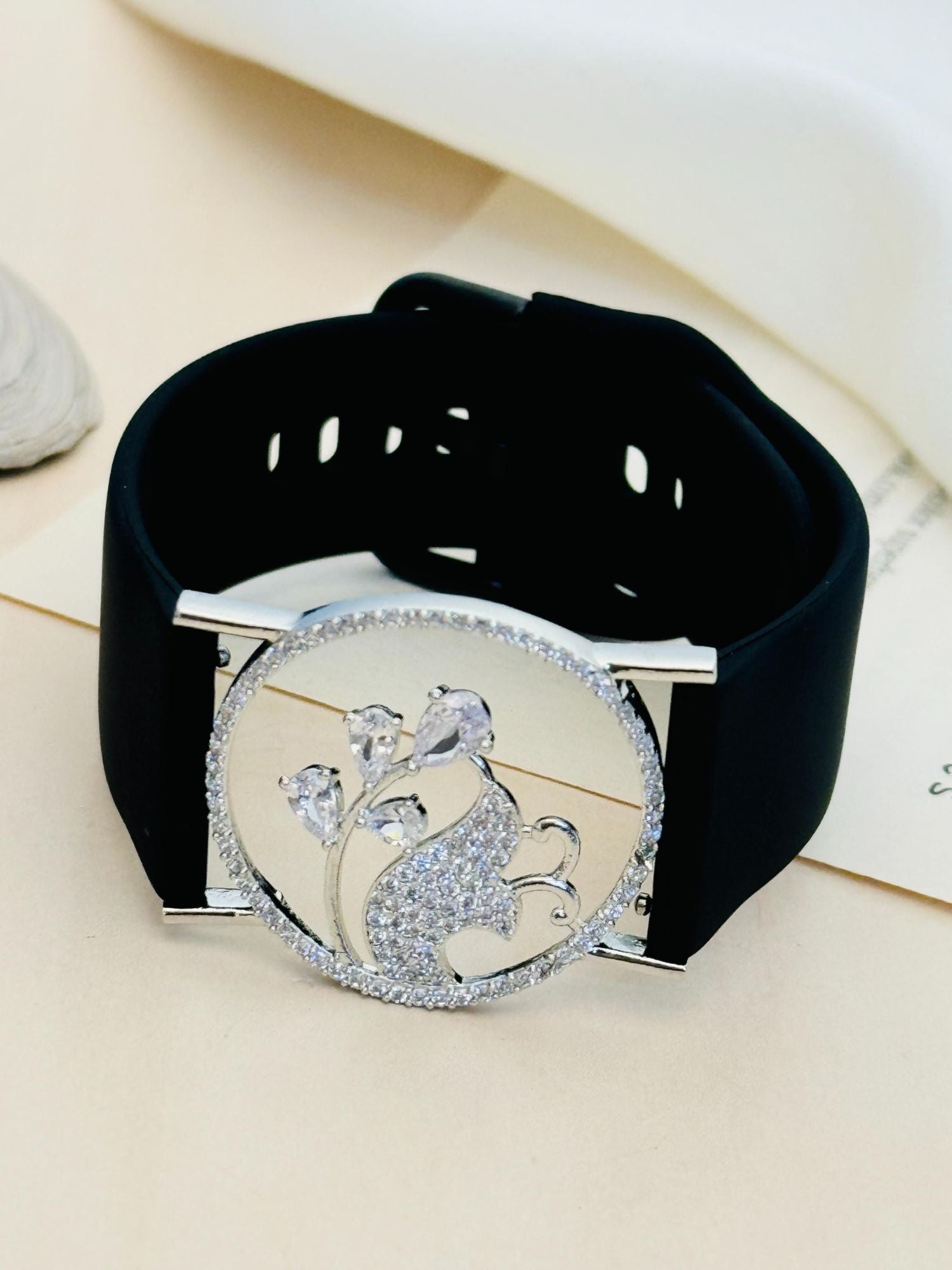 Abdesignsjewellery silver plated hand belt bracelet with black wide strap and round crystal encrusted floral medallion