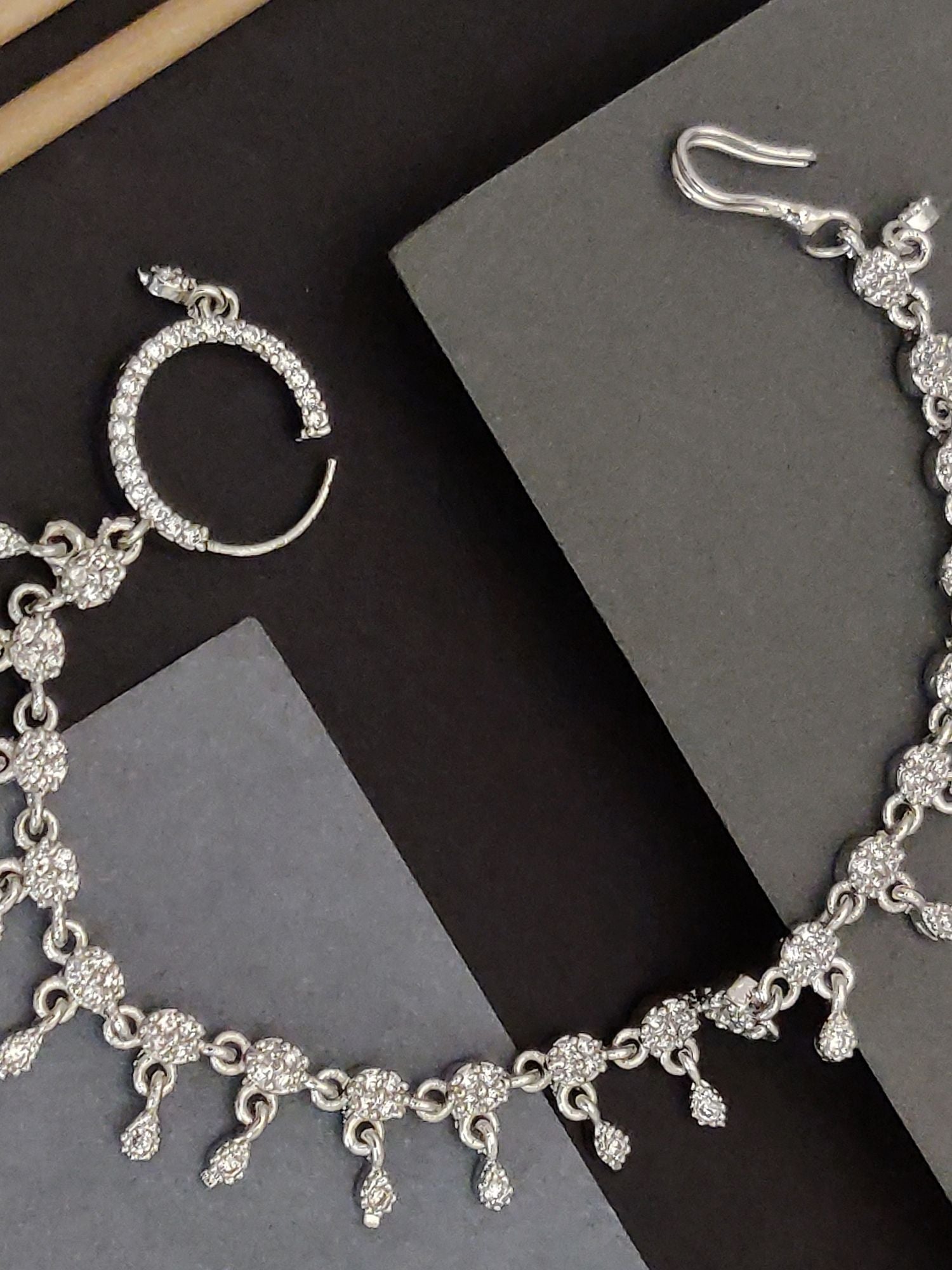 Elegant silver-plated metal bracelet with sparkling embellishments and a secure clasp