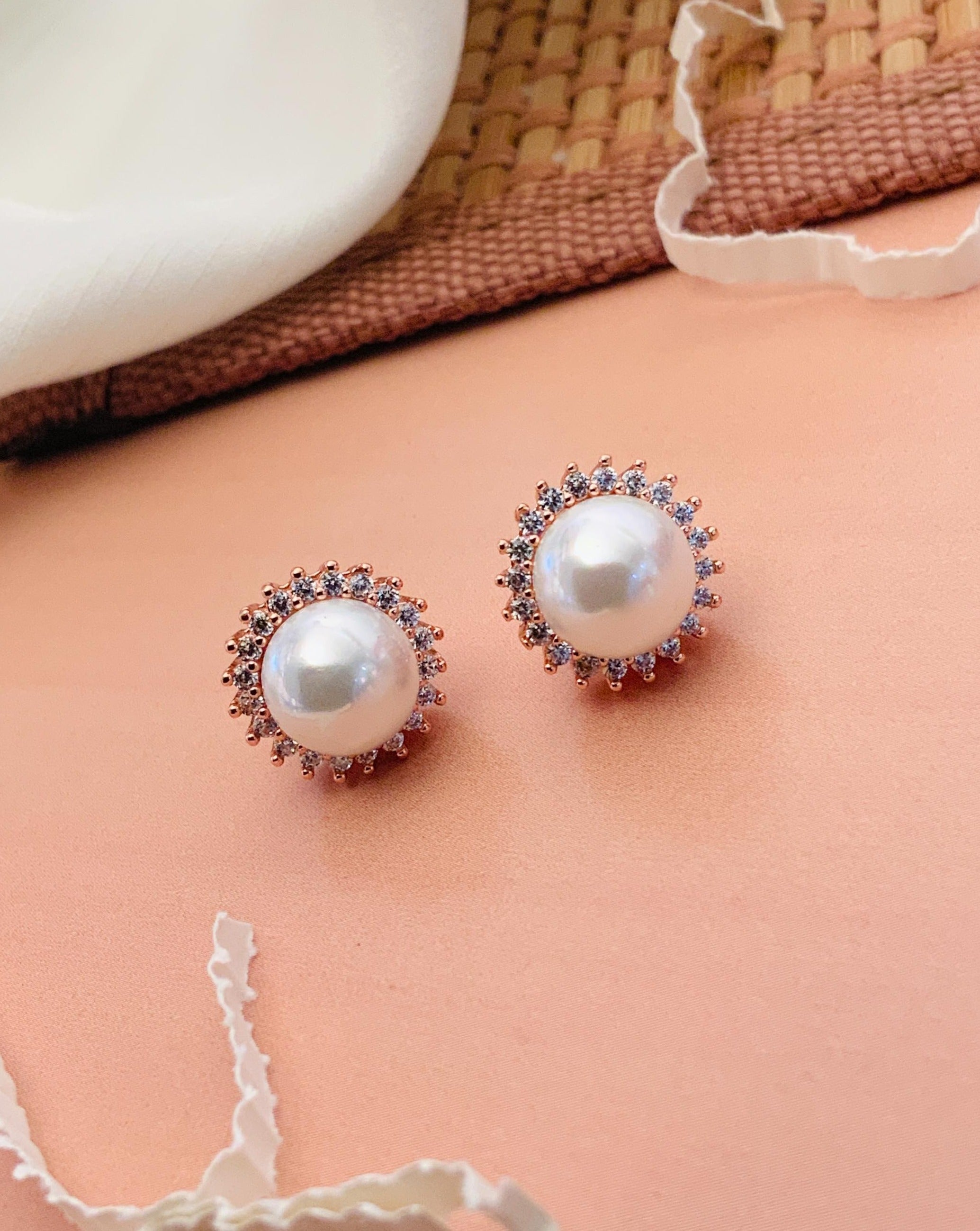 Abdesignsjewellery silver plated pearl stud earrings with crystal halo detailing pair on peach backdrop