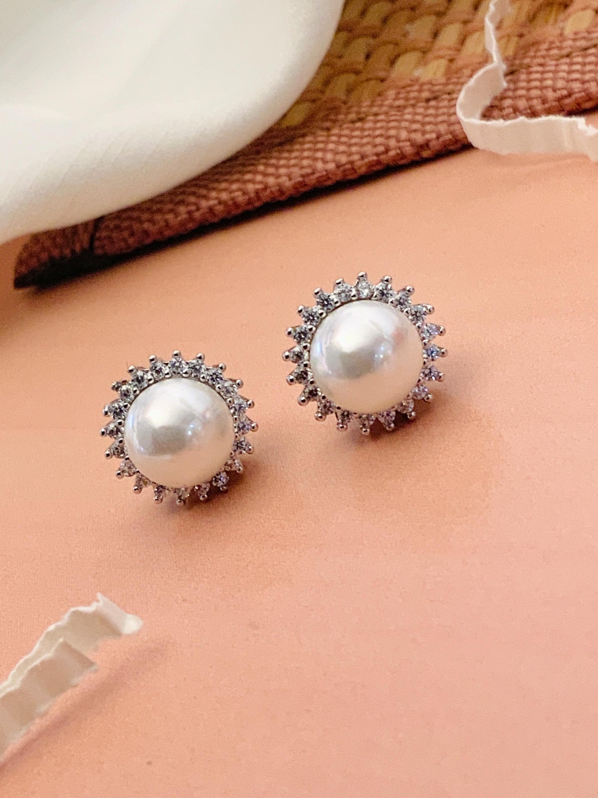 Abdesignsjewellery silver plated pearl stud earrings pair with crystal halo in silver setting on peach backdrop