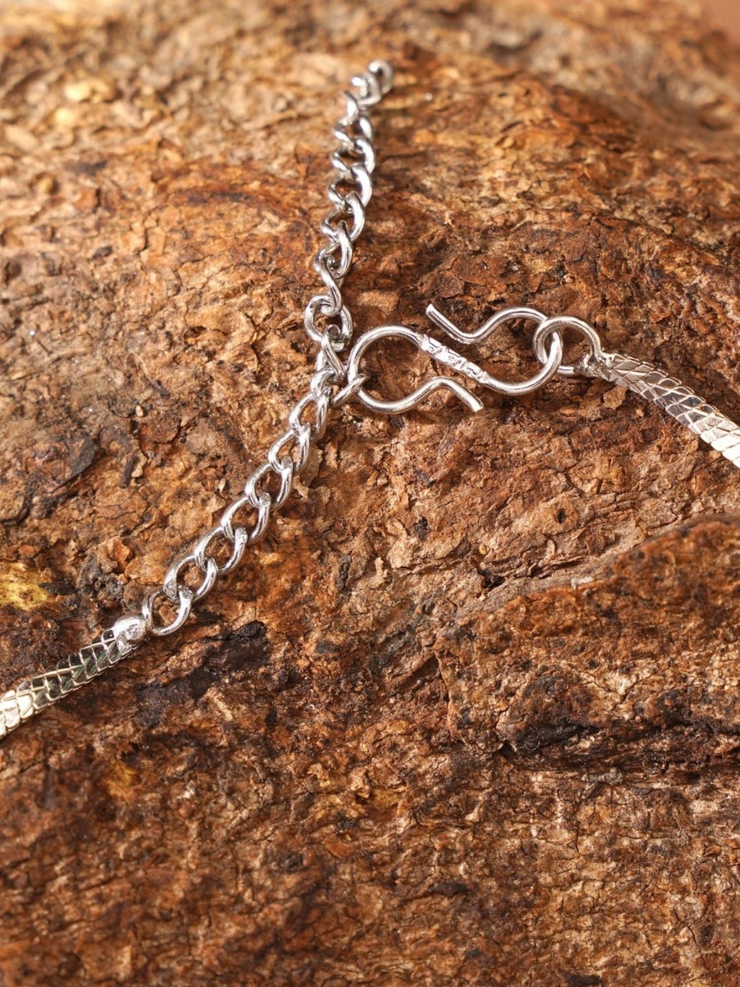 Abdesignsjewellery silver rhinestone necklace for women showing clasp and adjustable chain on textured background