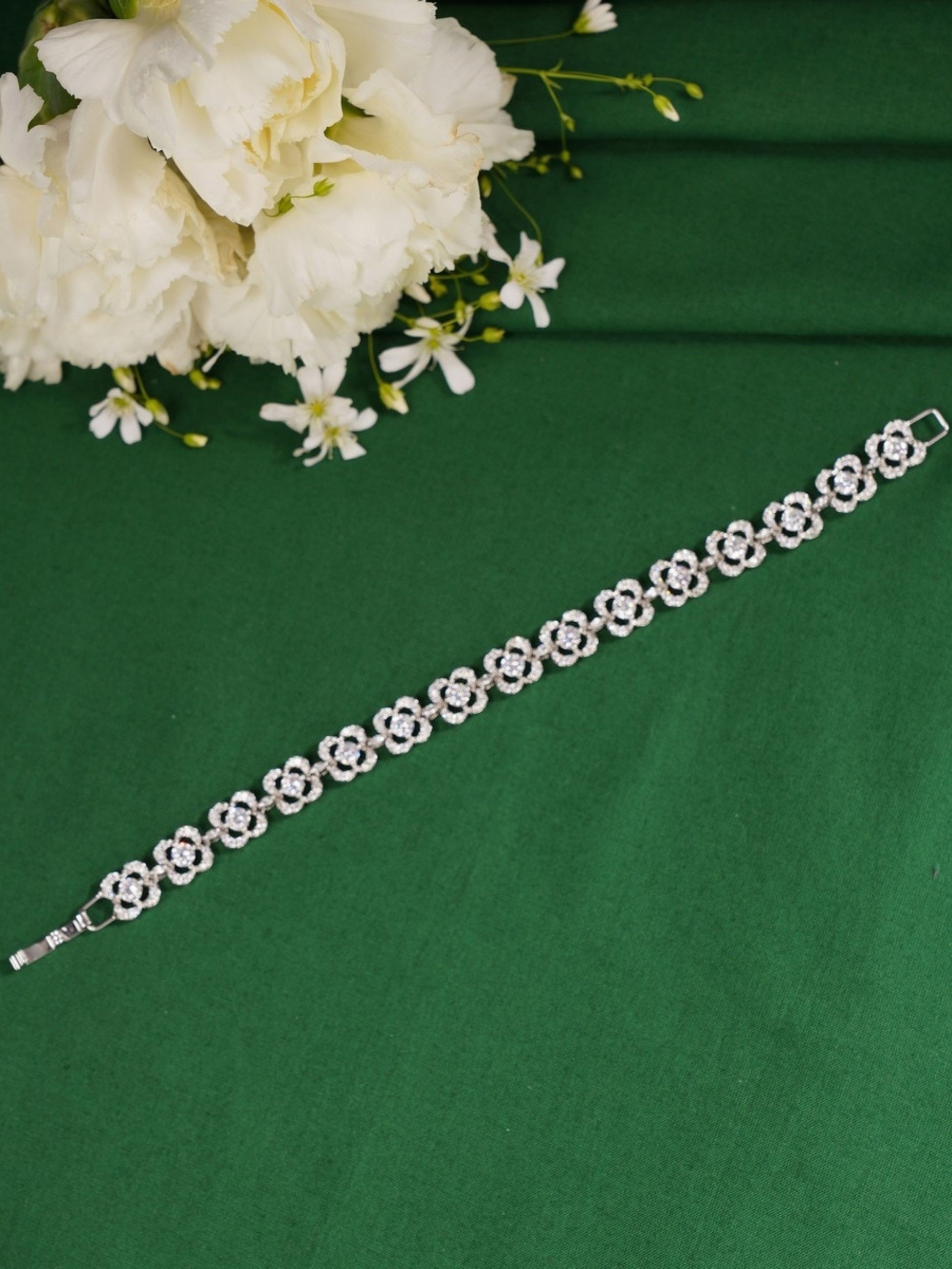 Silver Stunning Diamond Cz Bracelet by Abdesignsjewellery with floral design on green background
