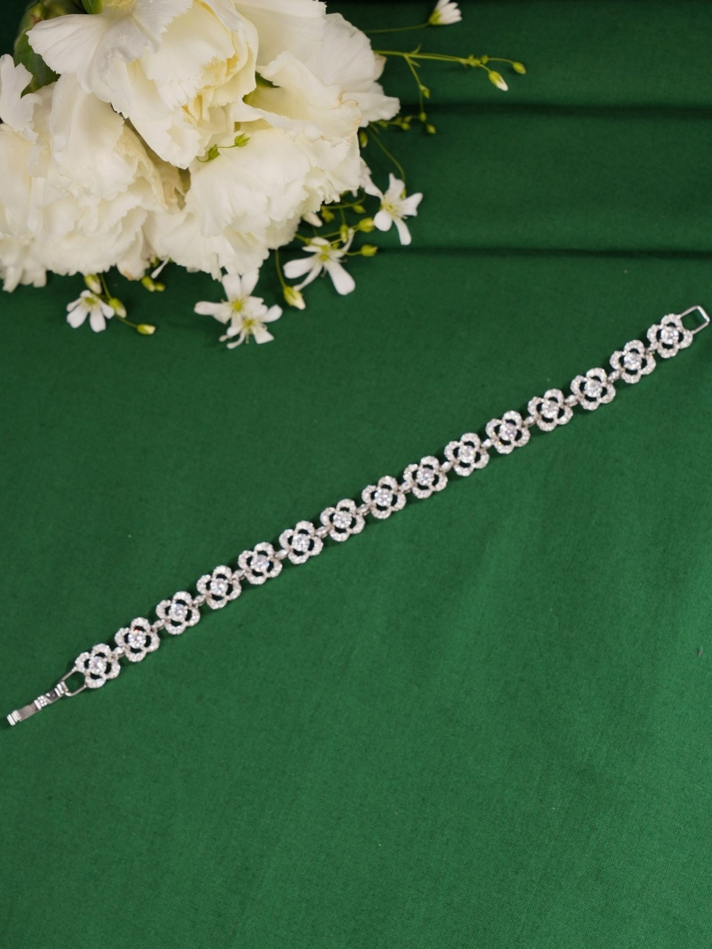 Silver Stunning Diamond Cz Bracelet by Abdesignsjewellery with floral design on green background