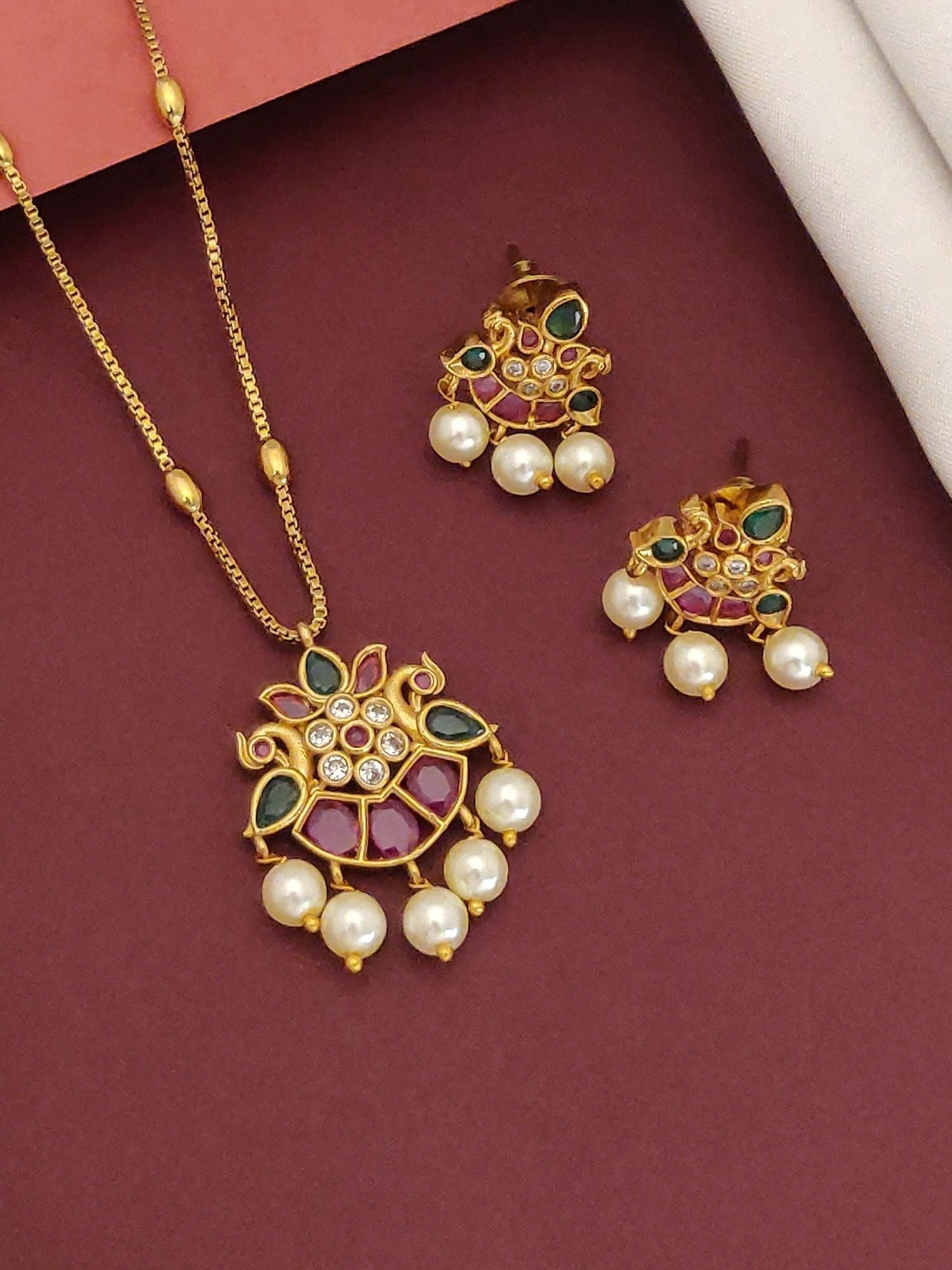 Simple Gold Plated Pachi Kundan Peacock Necklace Set featuring gold peacock pendant with pink and green stones and pearl drops