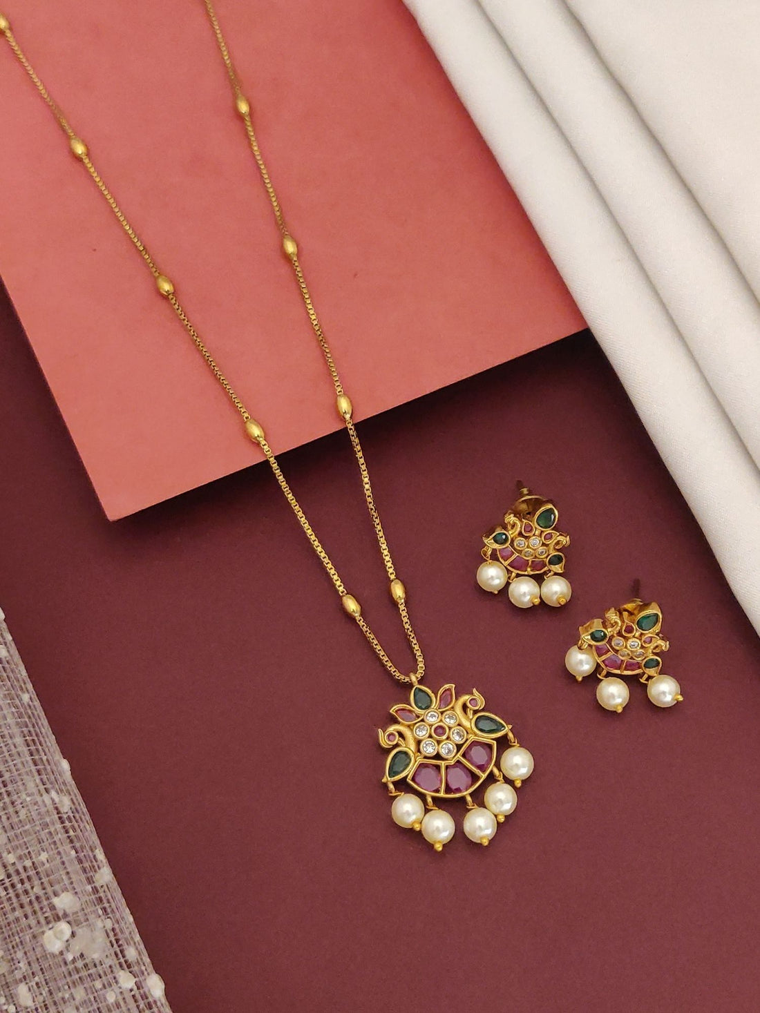 Simple Gold Plated Pachi Kundan Peacock Necklace Set featuring peacock pendant with pearls and matching earrings