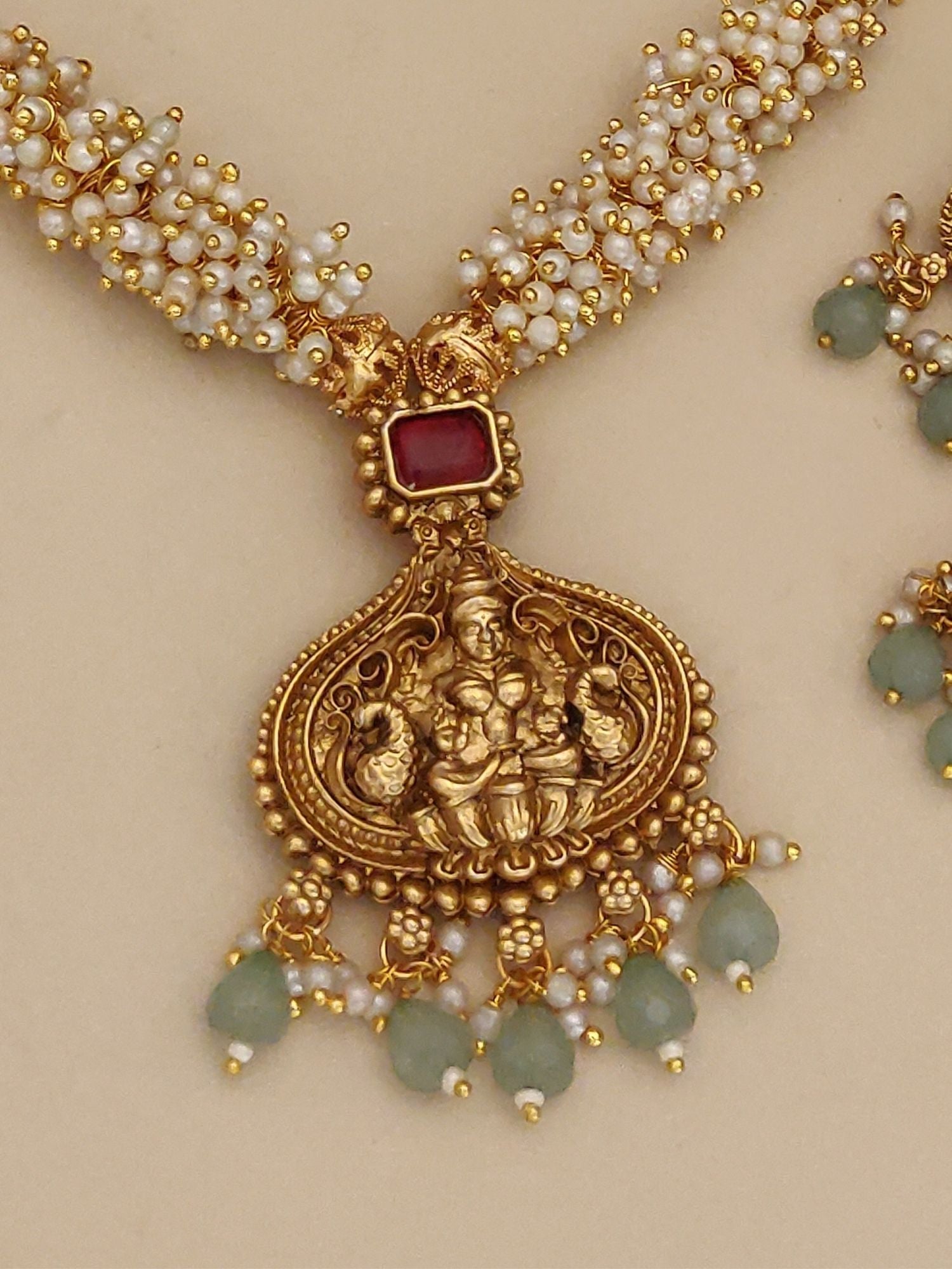 South Indian Gold Plated Temple Necklace Set by Abdesignsjewellery with temple pendant red stone pearl and green bead detailing