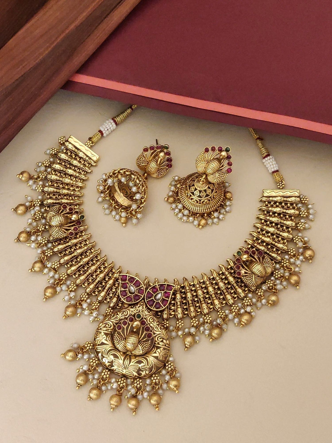 Southindian Antique Peacock Necklace Set by Abdesigns Jewellery. Gold temple necklace with pearls and matching jhumka earrings