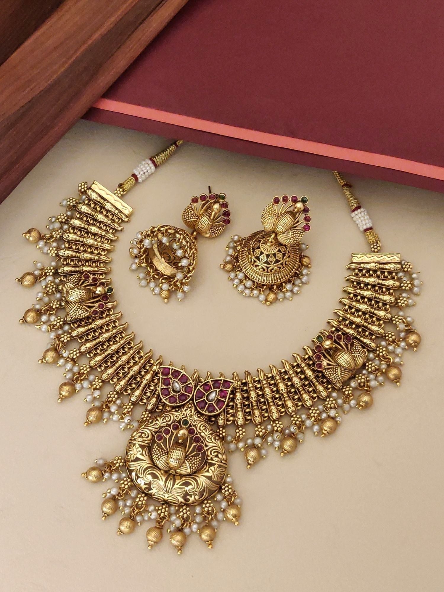 Southindian Antique Peacock Necklace Set by Abdesigns Jewellery. Gold temple necklace with peacock pendant and jhumkas