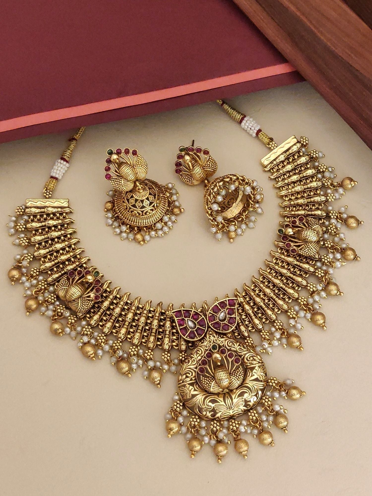 Southindian Antique Peacock Necklace Set by Abdesigns Jewellery. Gold peacock temple necklace with pearl drops and earrings