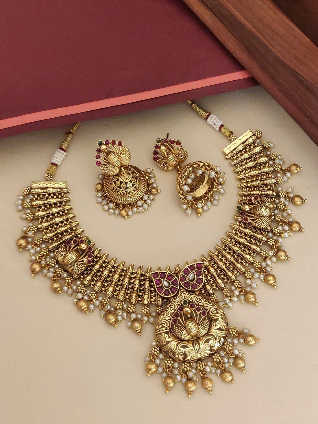 Southindian Antique Peacock Necklace Set by Abdesigns Jewellery. Gold temple necklace with pearls and matching jhumka earrings
