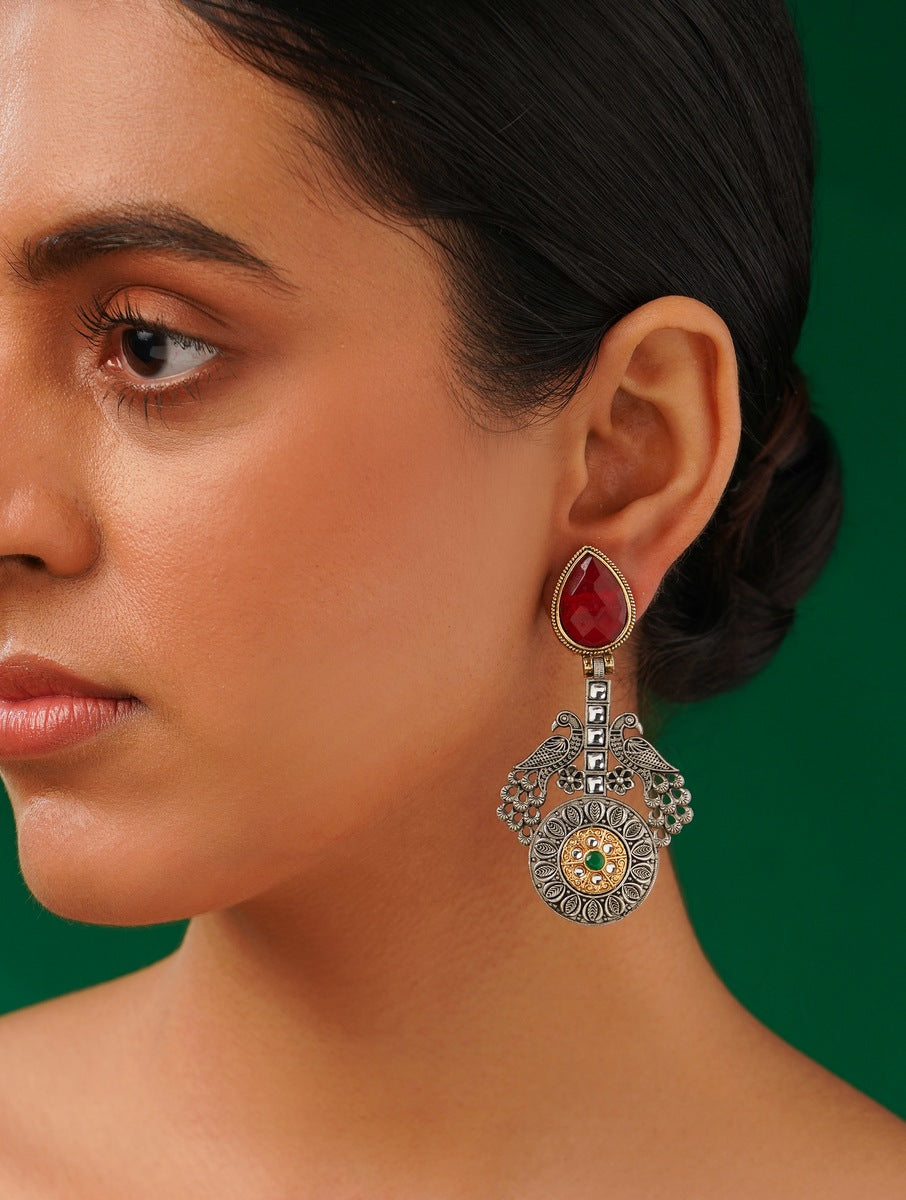 Statement German Antique Silver Plated Peacock Earring worn by woman with red stone and intricate design