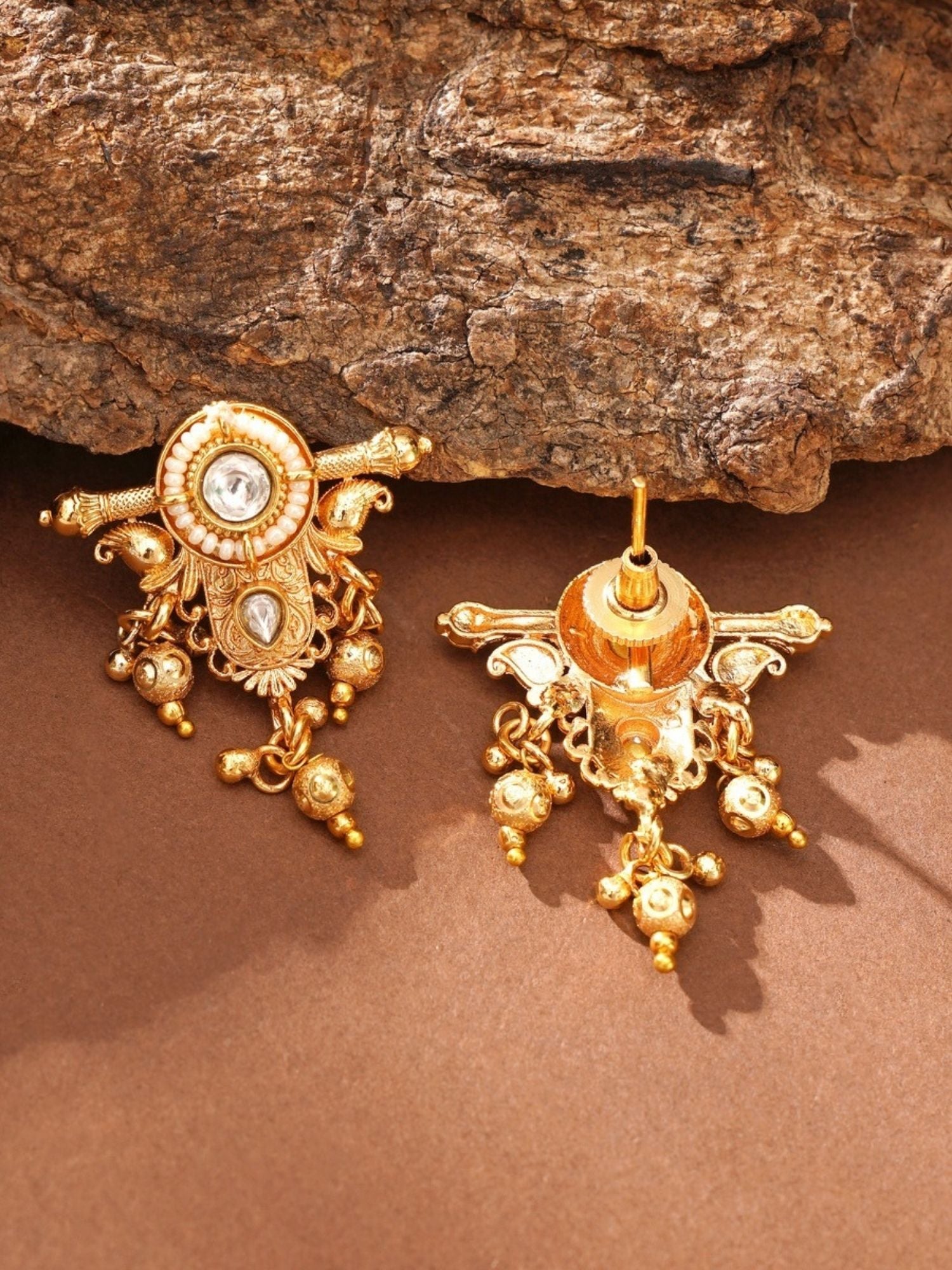 Abdesignsjewellery traditional Indian gold choker necklace styled ornate gold pendant pair on stone