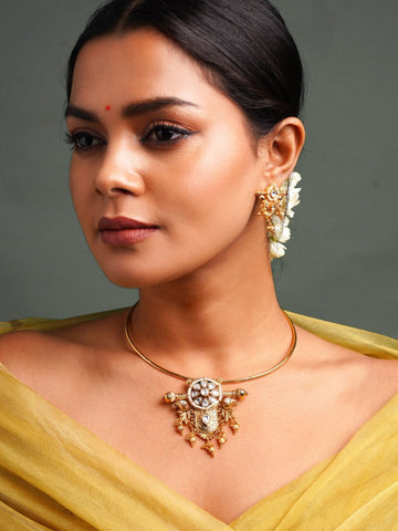 Abdesignsjewellery model wearing traditional Indian gold choker necklace with ornate pendant and matching earring