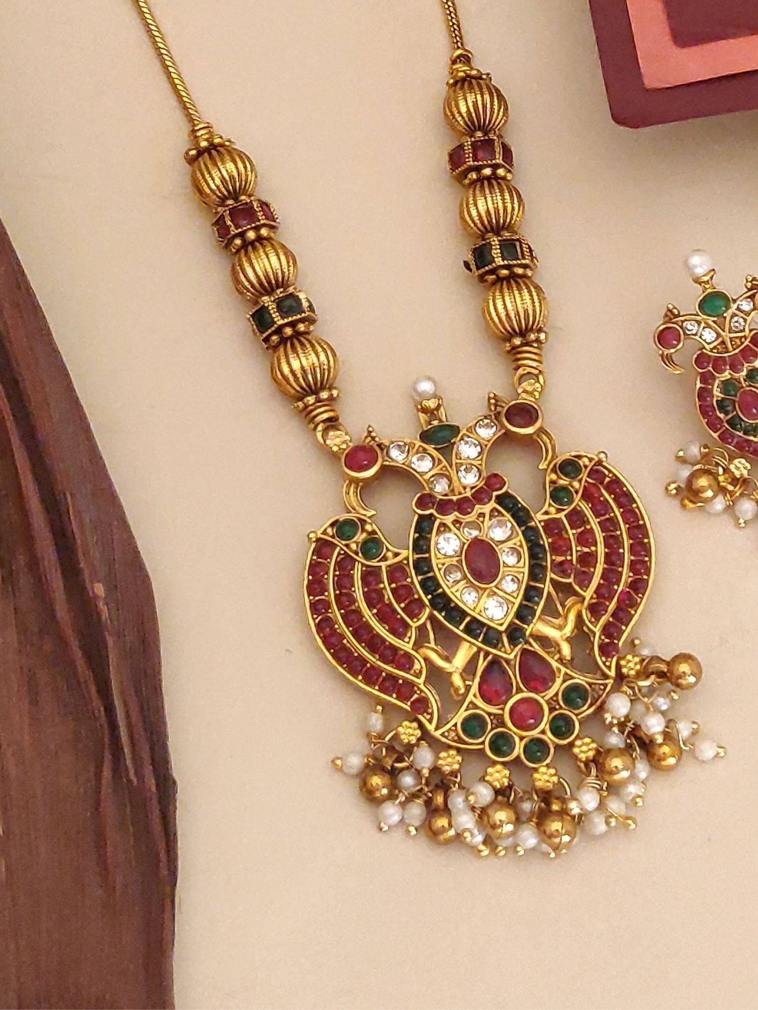 Abdesignsjewellery traditional pendant chain set gold temple pendant with red and green stones and pearl drops