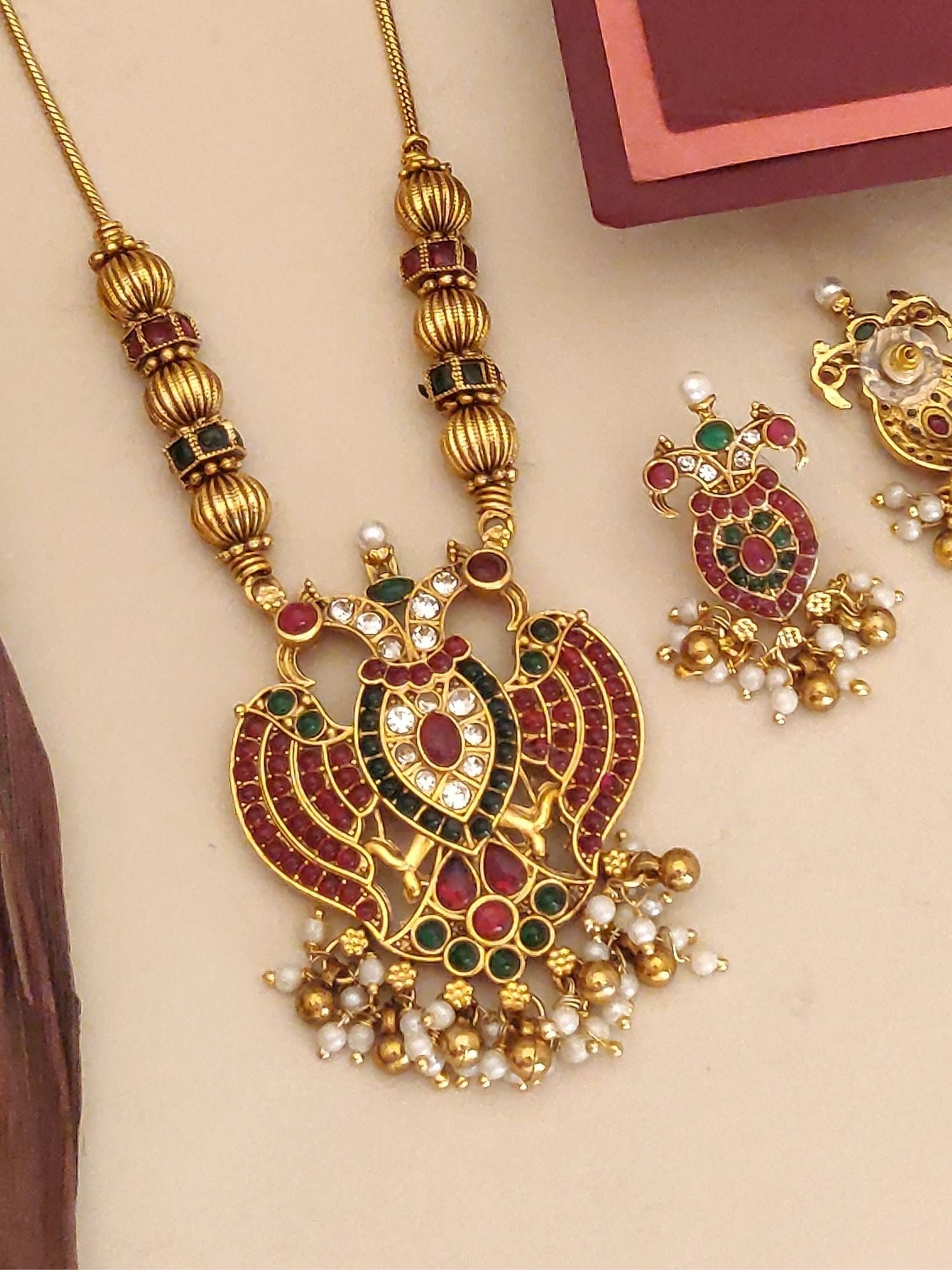 Abdesignsjewellery traditional pendant chain set gold peacock motif with red green stones and pearl drops