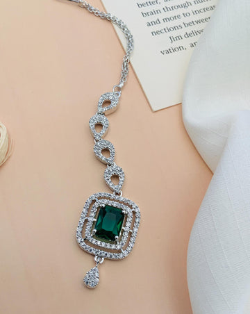 Wedding Silver Plated American Diamond Maangtikka with green centerpiece and intricate chain design