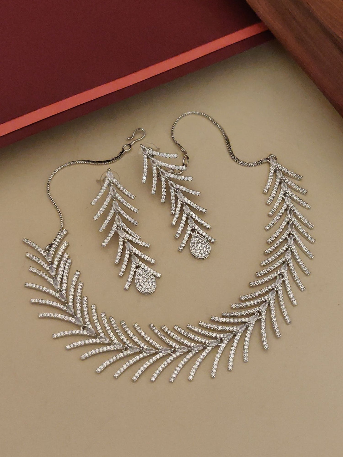 Affordable statement American Diamond necklace for women with matching leaf design earrings by Abdesignsjewellery