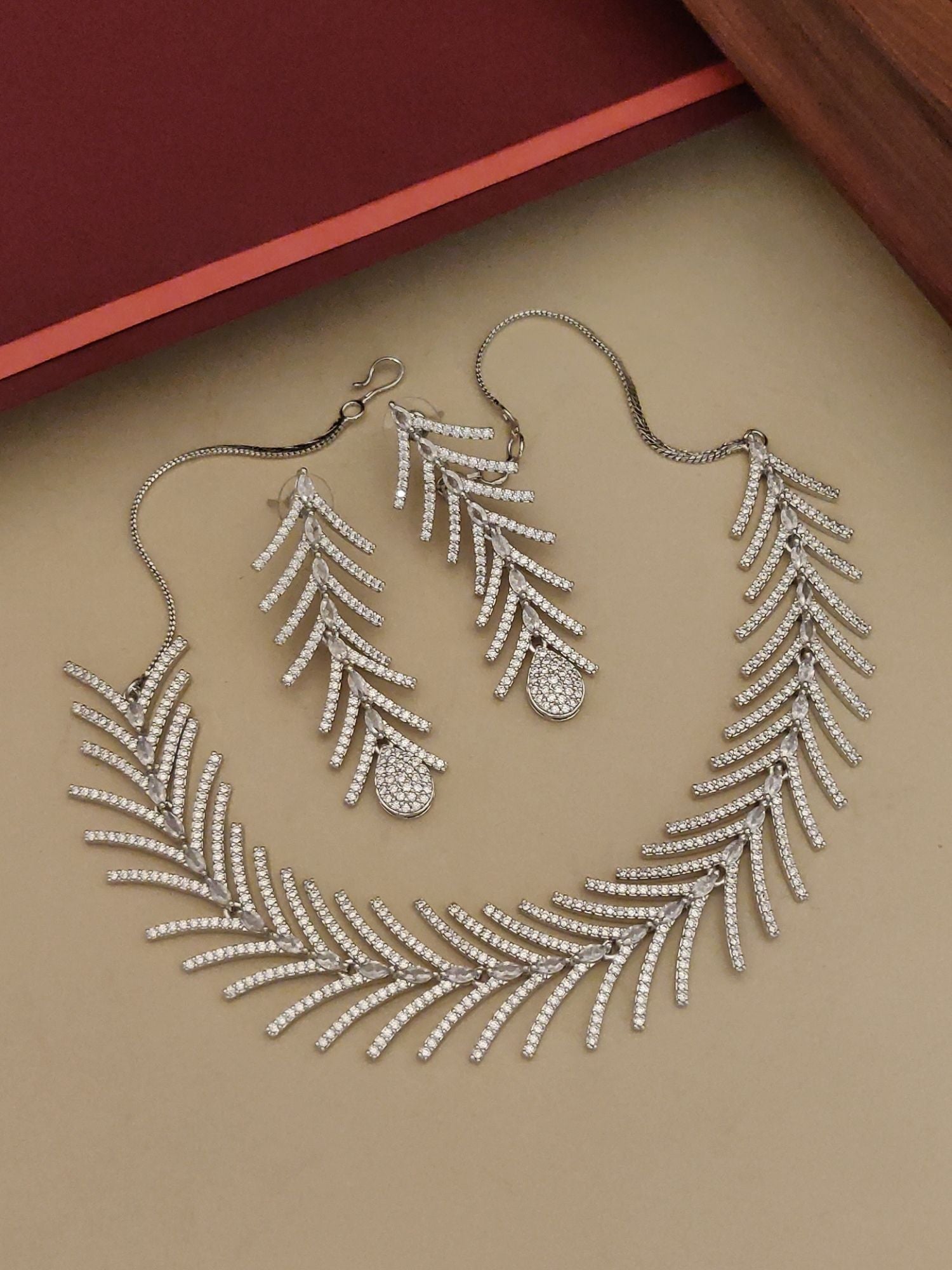 Affordable statement American Diamond necklace for women with matching leaf design earrings by Abdesignsjewellery