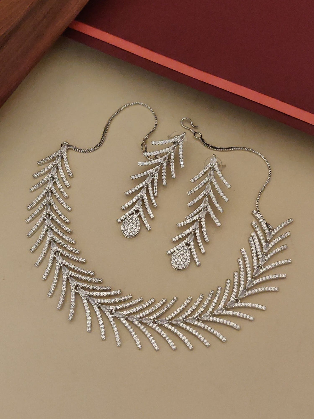 Affordable statement American Diamond necklace for women with matching leaf design earrings by Abdesignsjewellery