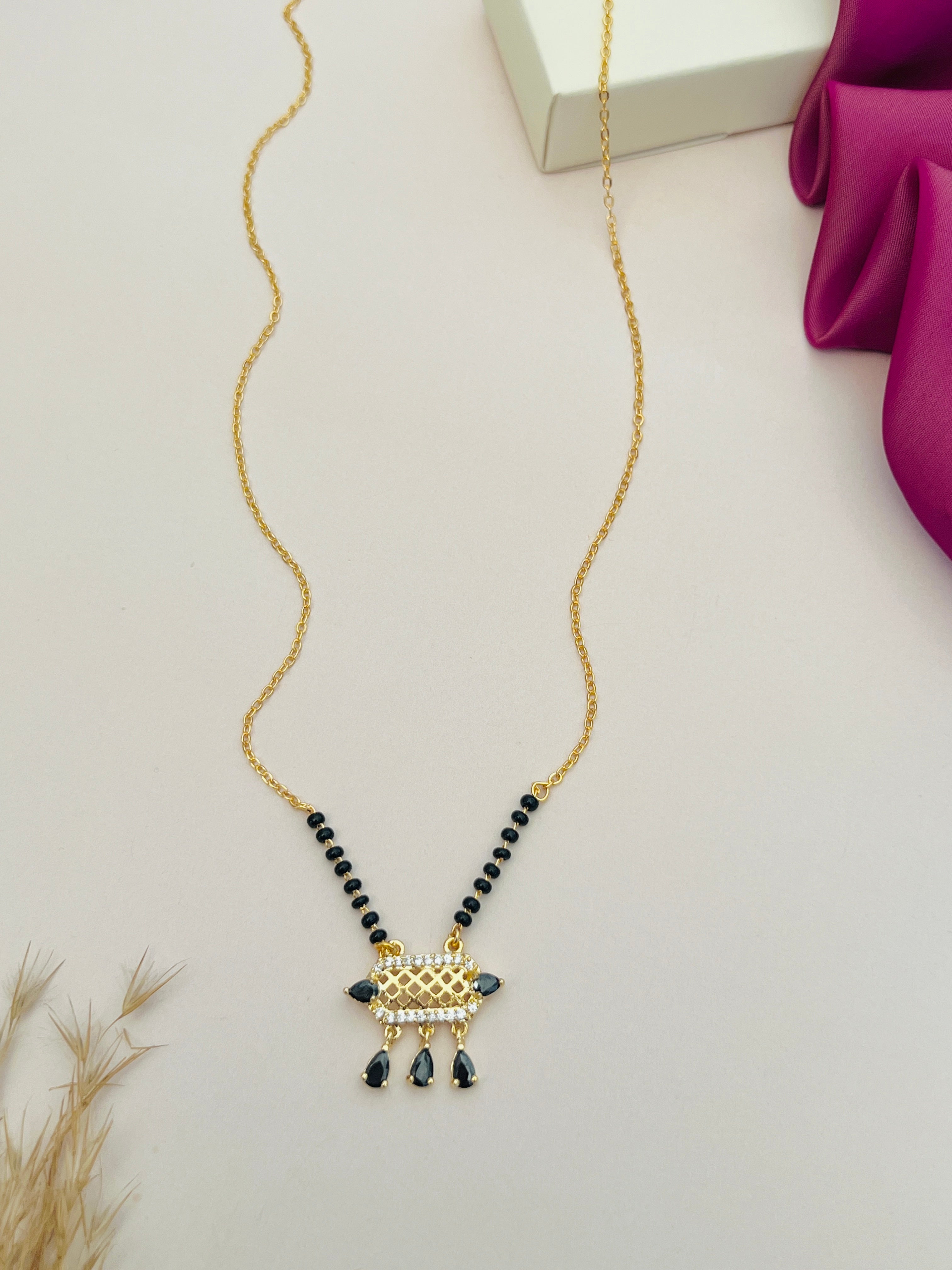 Elegant American Diamond Mangalsutra with black beads and gold chain by Abdesignsjewellery