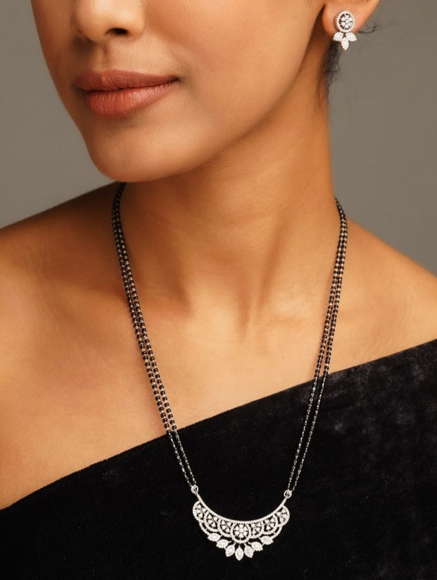 Elegant American Diamond Mangalsutra Set with intricate pendant worn by woman in black dress