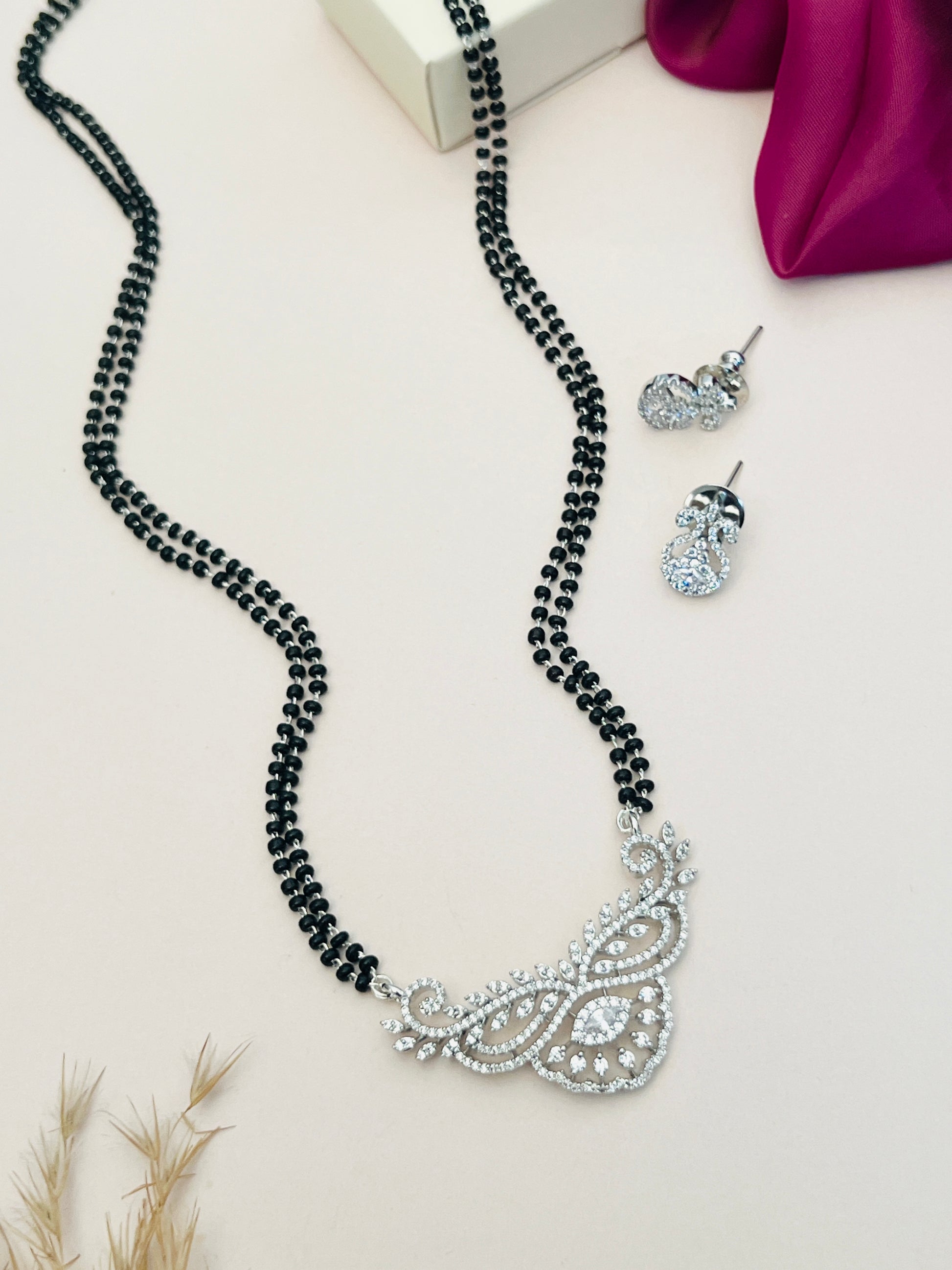 Abdesignsjewellery American Diamond Mangalsutra Set with black beads and intricate silver pendant with matching earrings
