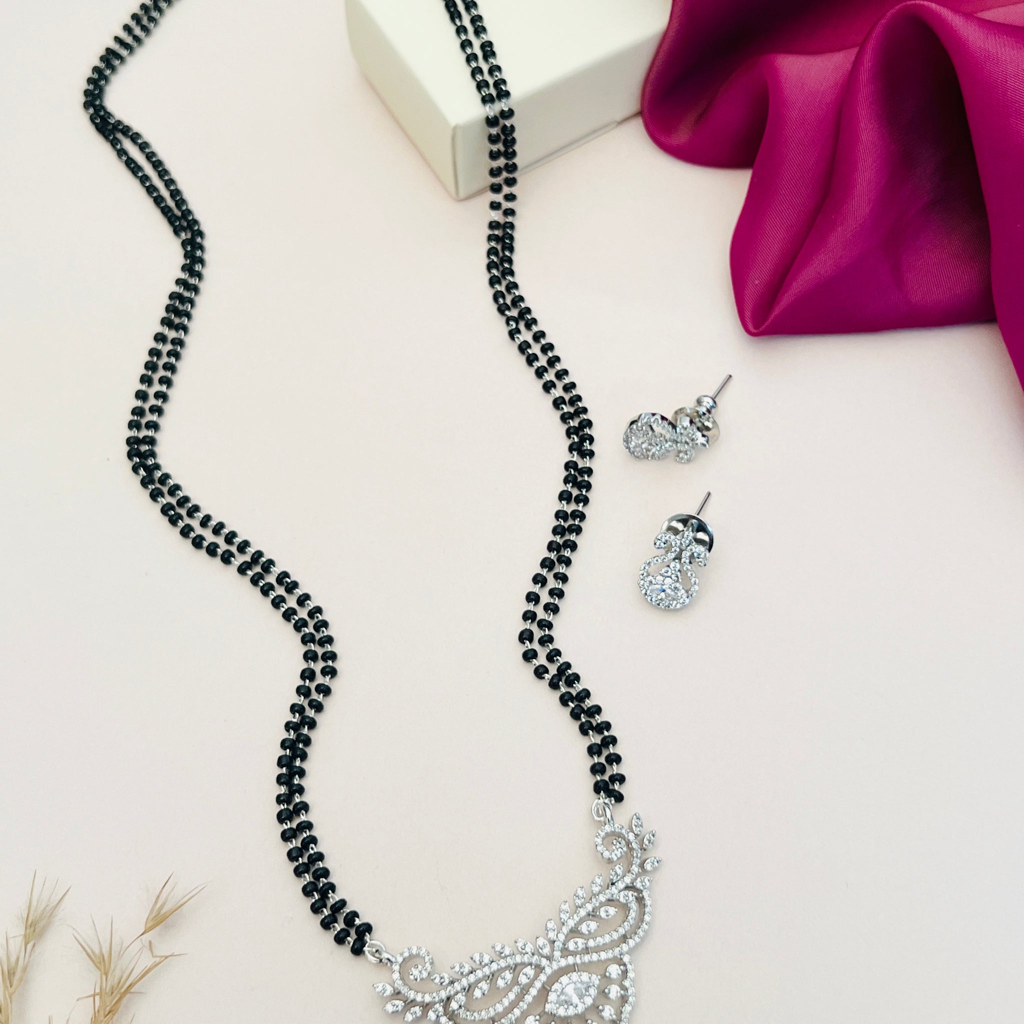 Abdesignsjewellery American Diamond Mangalsutra Set with intricate pendant and matching earrings