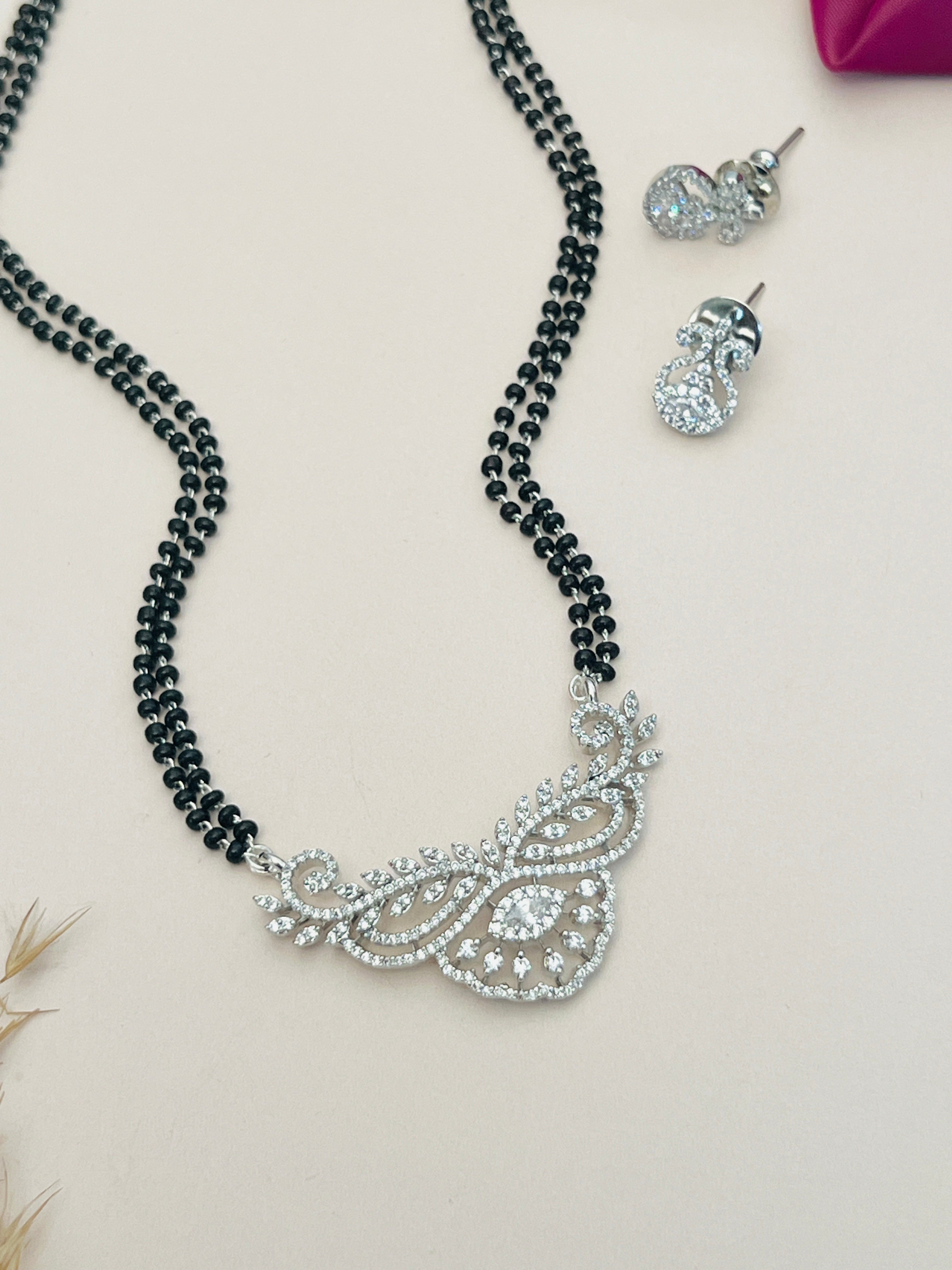 Elegant American Diamond Mangalsutra Set with black beads and sparkling diamond pendant with matching earrings