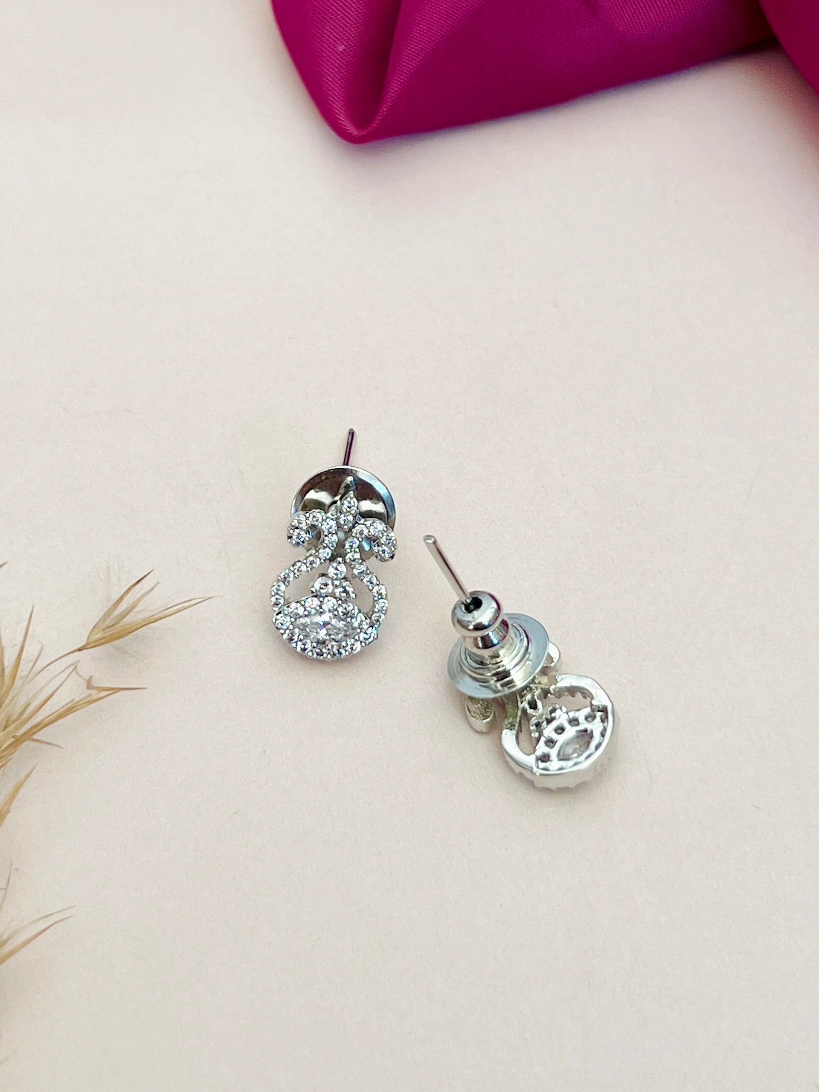 Abdesignsjewellery American Diamond Mangalsutra Set stud earrings with sparkling stones on light background