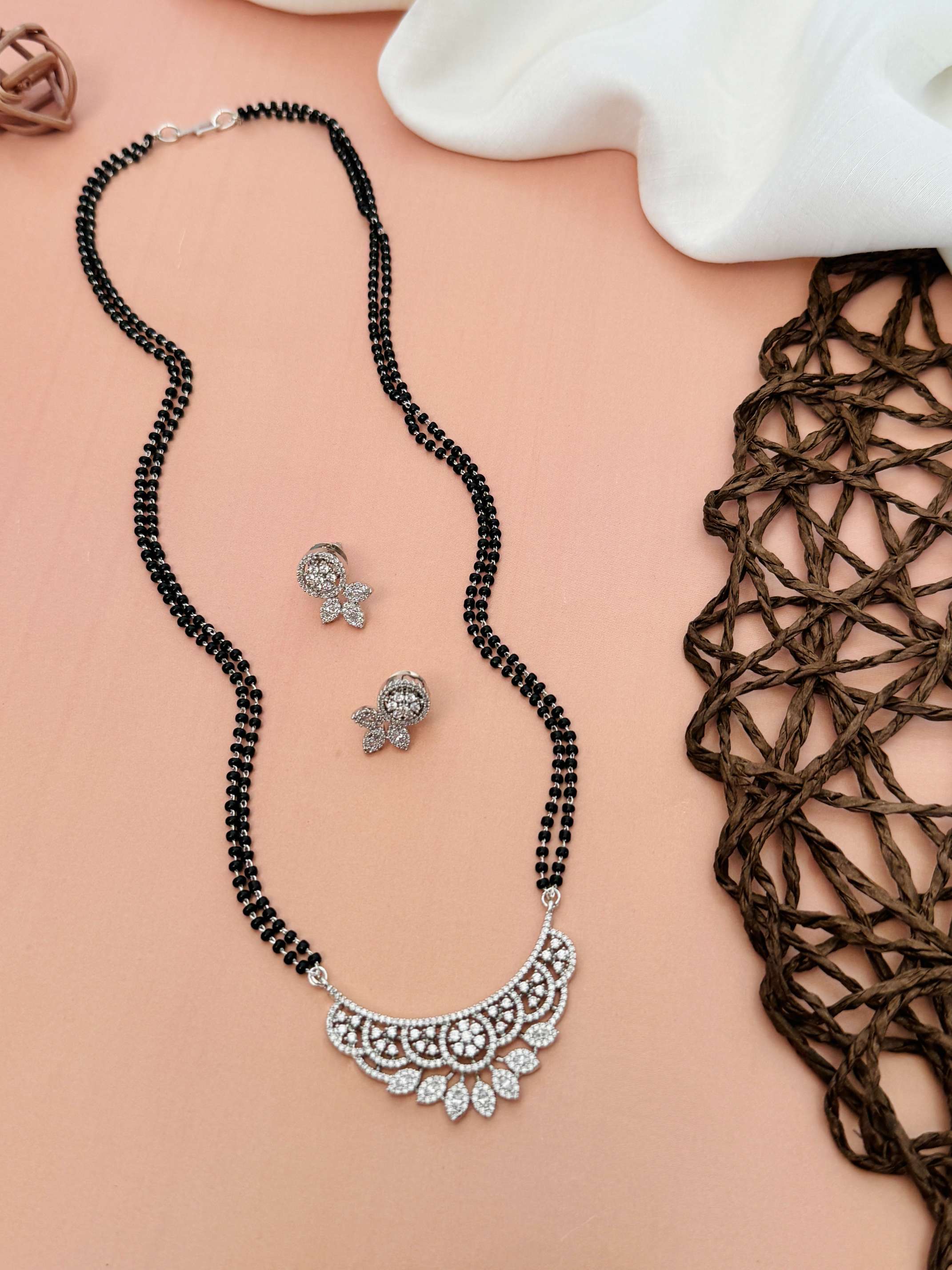 Abdesignsjewellery American Diamond Mangalsutra Set with black beads and intricate silver pendant with matching earrings