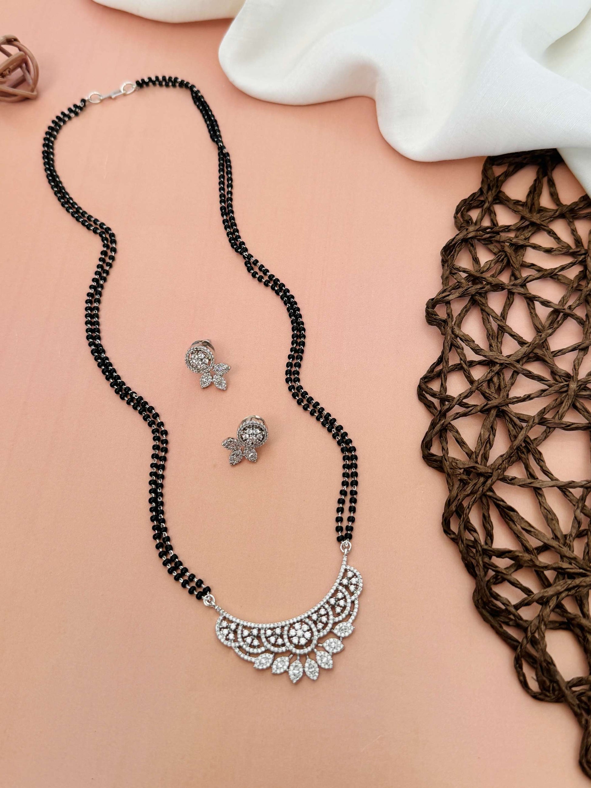 Abdesignsjewellery American Diamond Mangalsutra Set with intricate silver pendant and matching earrings