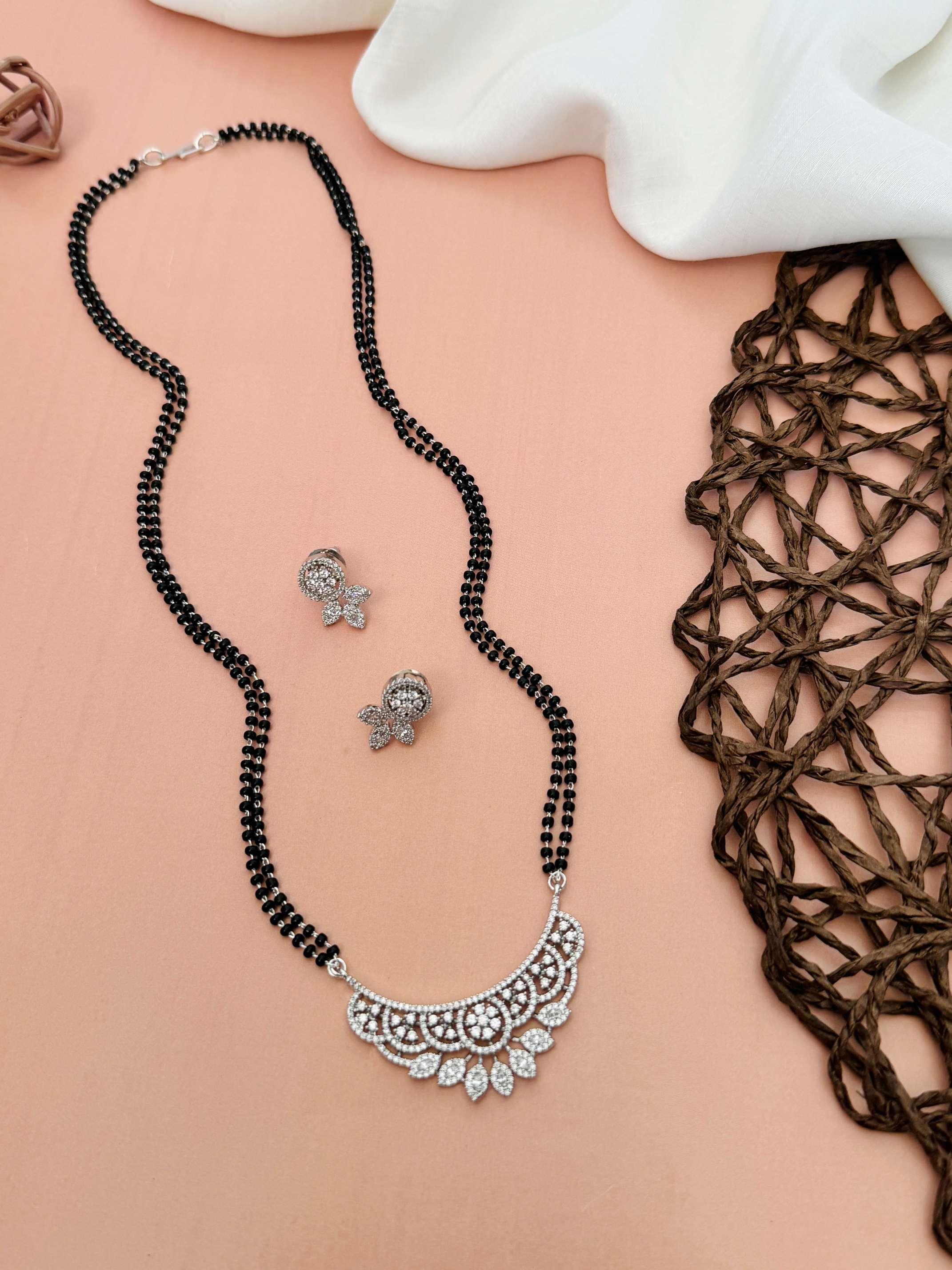 Abdesignsjewellery American Diamond Mangalsutra Set with intricate silver pendant and matching earrings