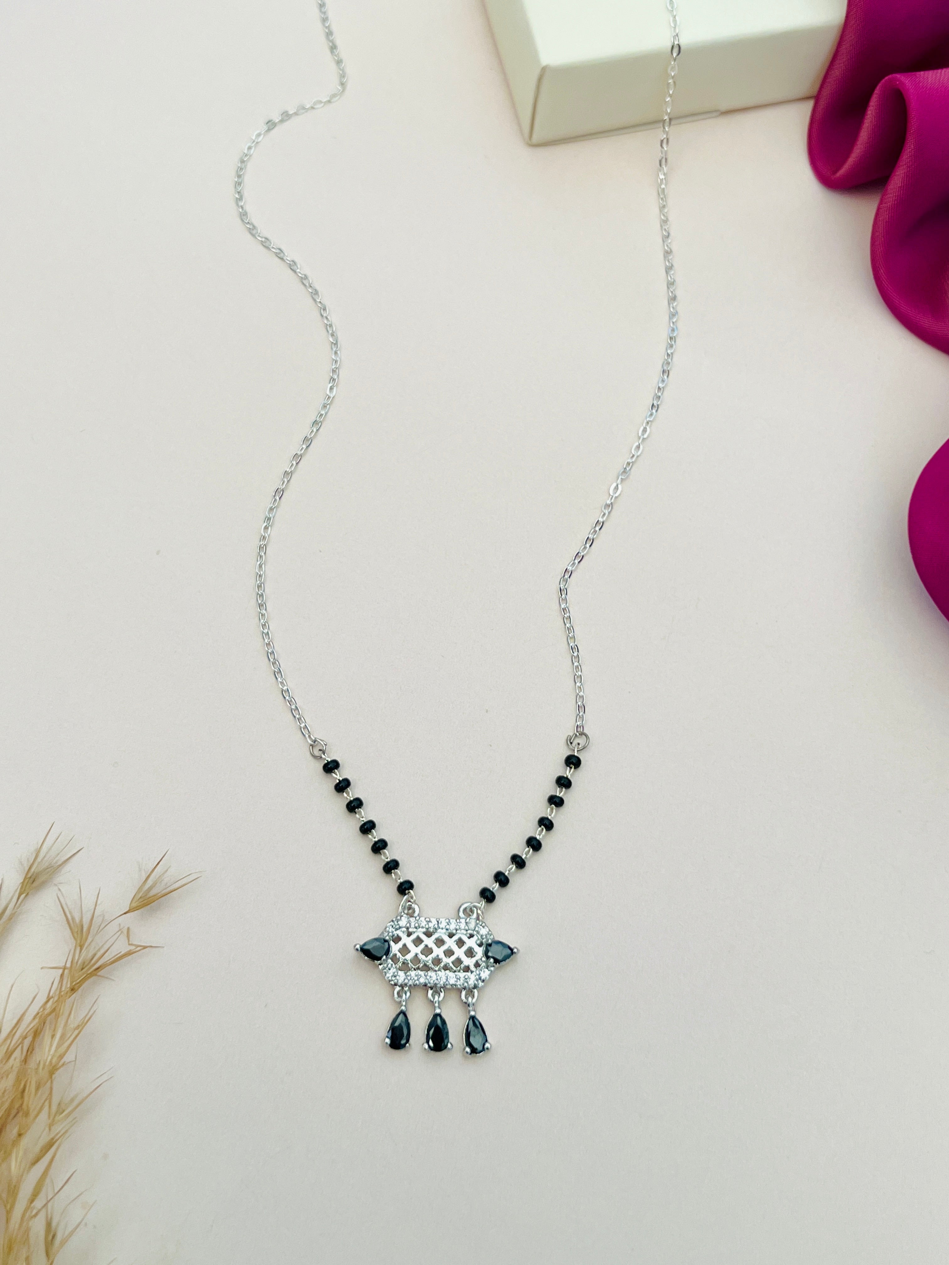 Elegant American Diamond Mangalsutra with black beads and silver pendant by Abdesignsjewellery