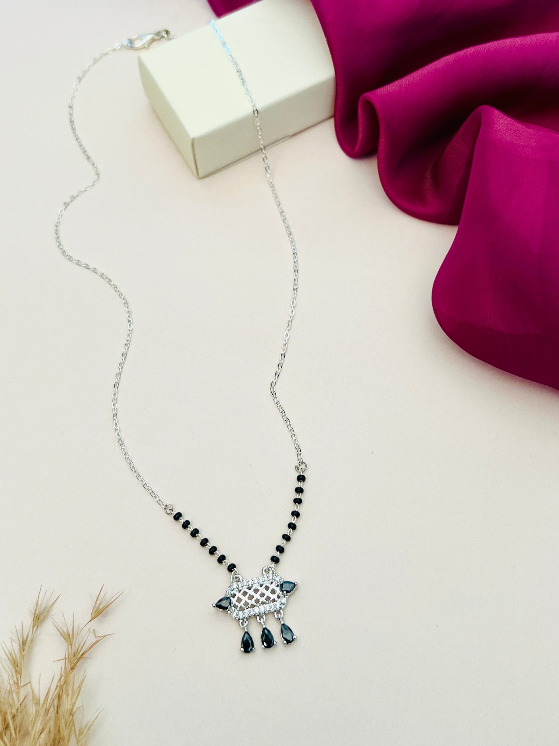 Abdesignsjewellery American Diamond Mangalsutra with black beads and intricate silver pendant design