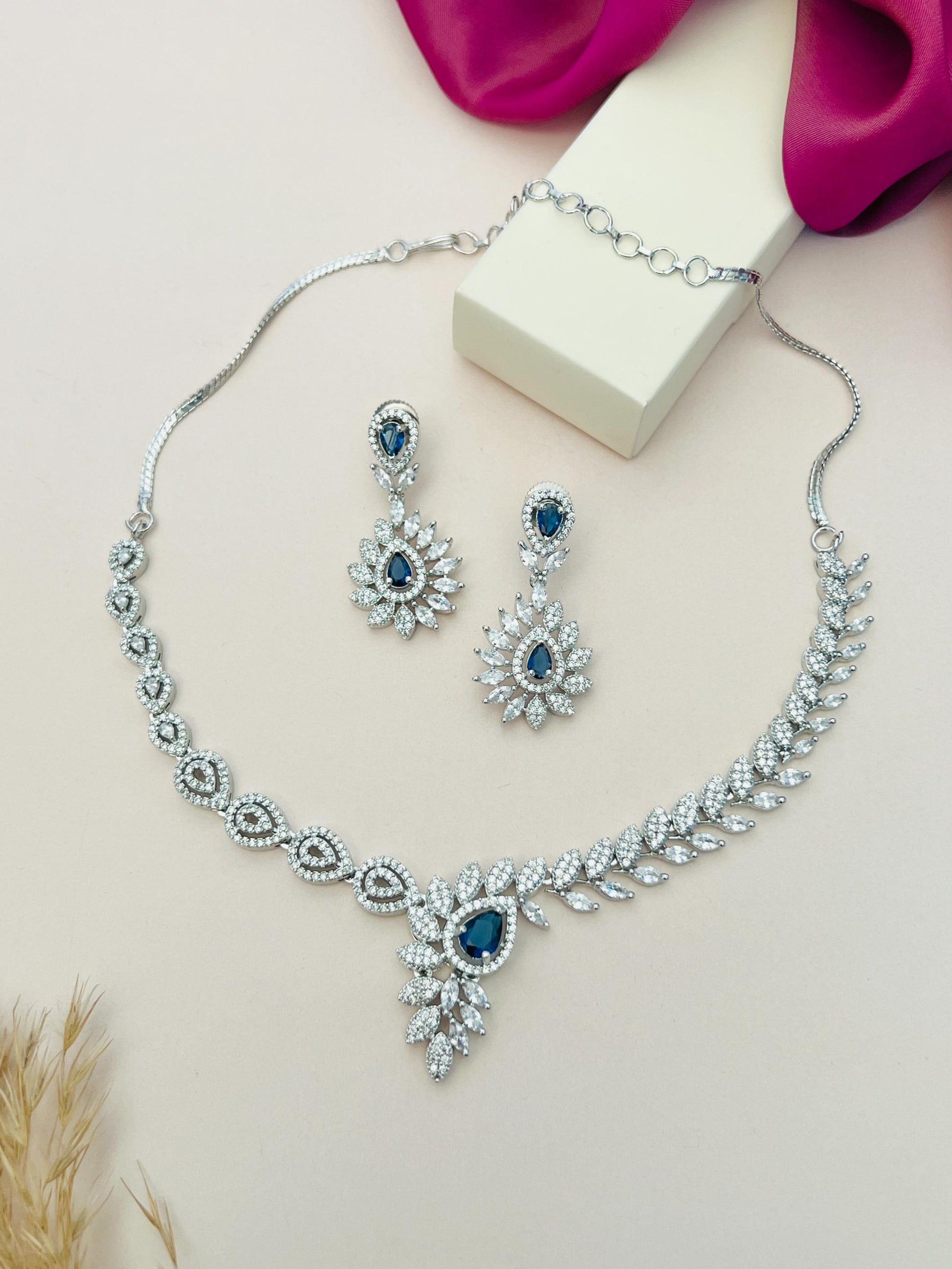 Artistic Silver Plated American Diamond Necklace with matching blue and white stone earrings by Abdesignsjewellery