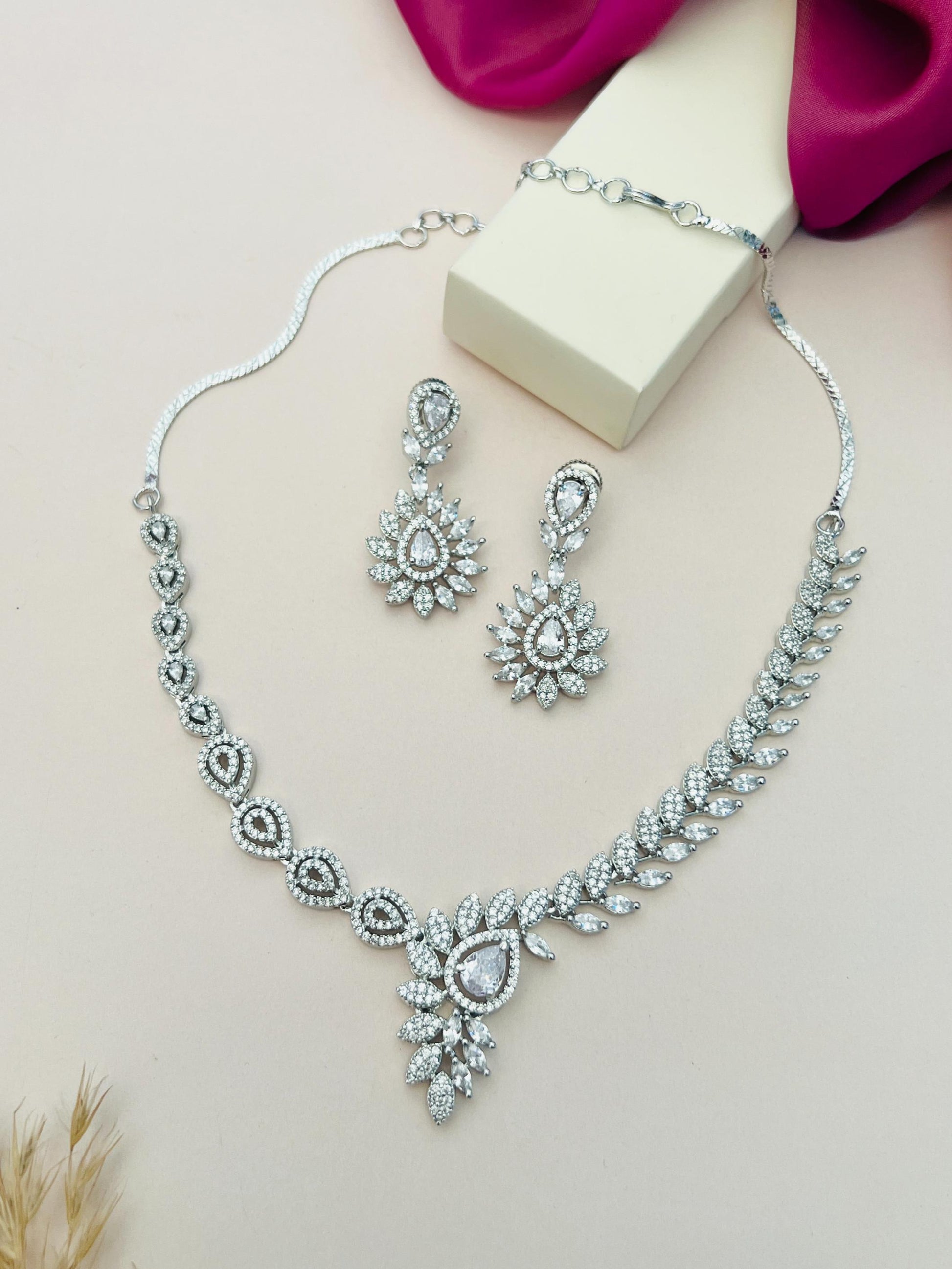 Artistic Silver Plated American Diamond Necklace with matching intricate earrings by Abdesignsjewellery