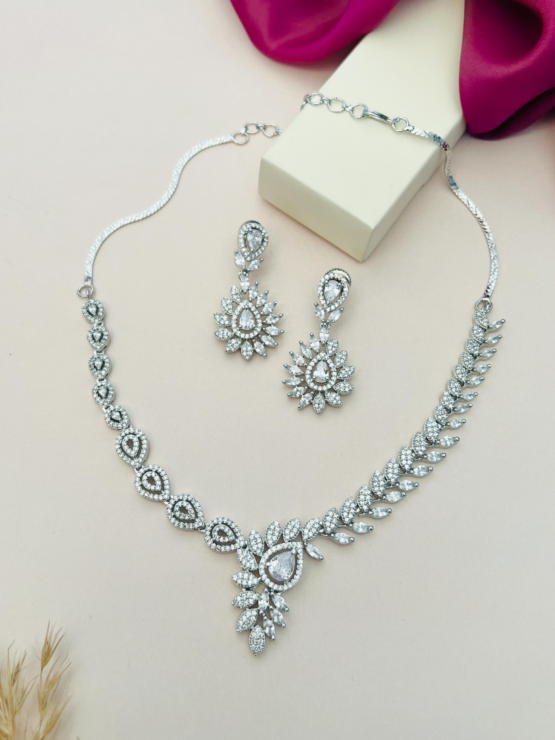 Artistic Silver Plated American Diamond Necklace with matching intricate earrings by Abdesignsjewellery