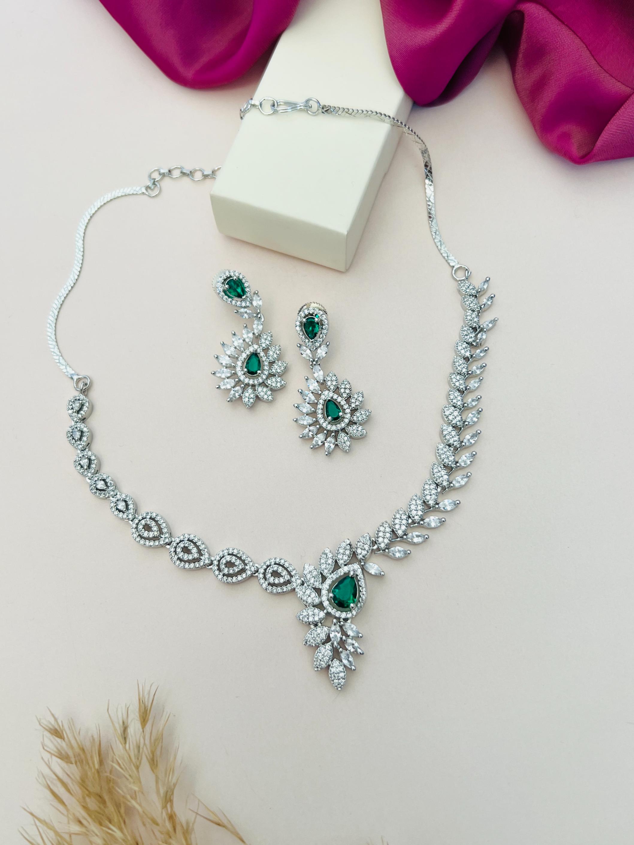 Artistic Silver Plated American Diamond Necklace with matching green gemstone earrings by Abdesignsjewellery