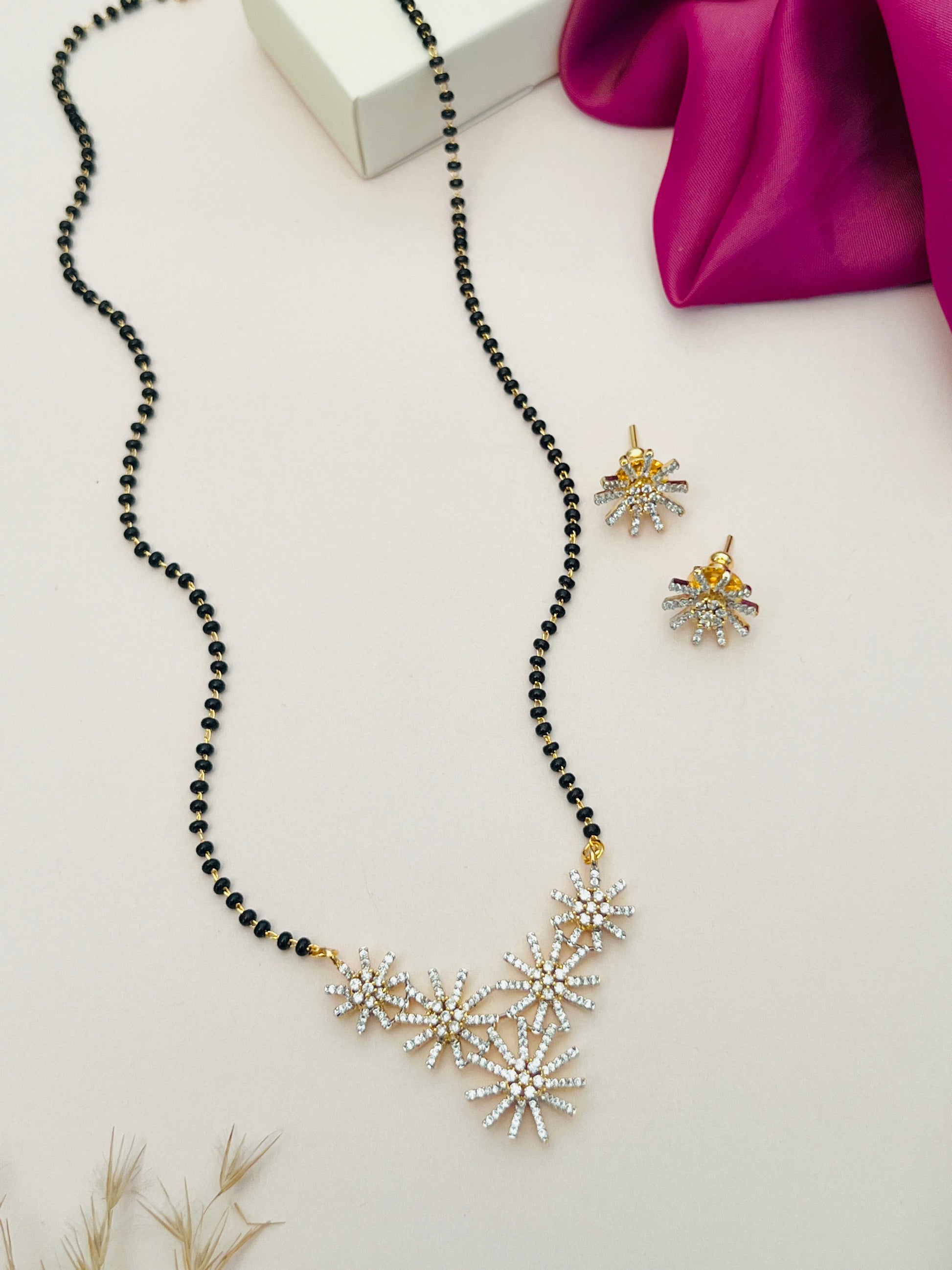 Gold Plated American Diamond Mangalsutra Set with black beads necklace and matching earrings