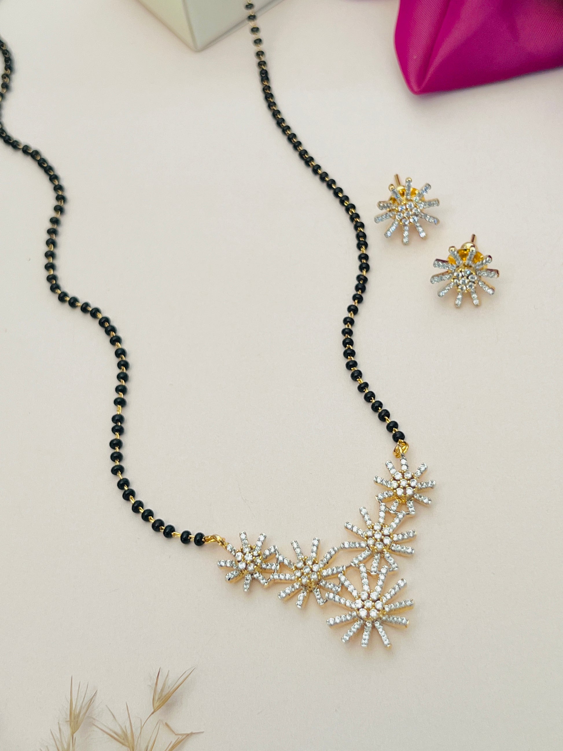 Gold Plated American Diamond Mangalsutra Set with black beads and floral design by Abdesignsjewellery