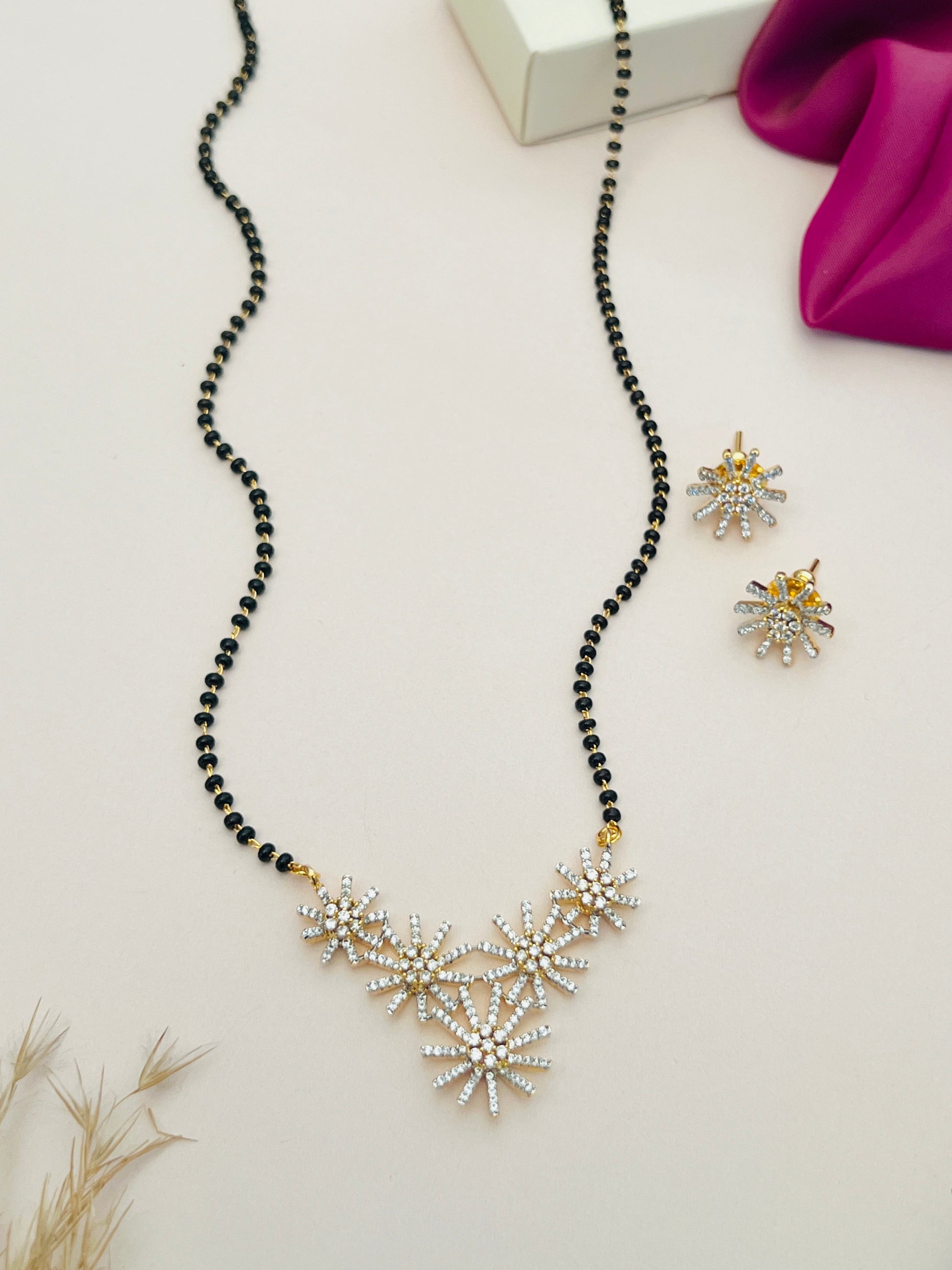 Gold Plated American Diamond Mangalsutra Set with black beads and floral pendant design by Abdesignsjewellery