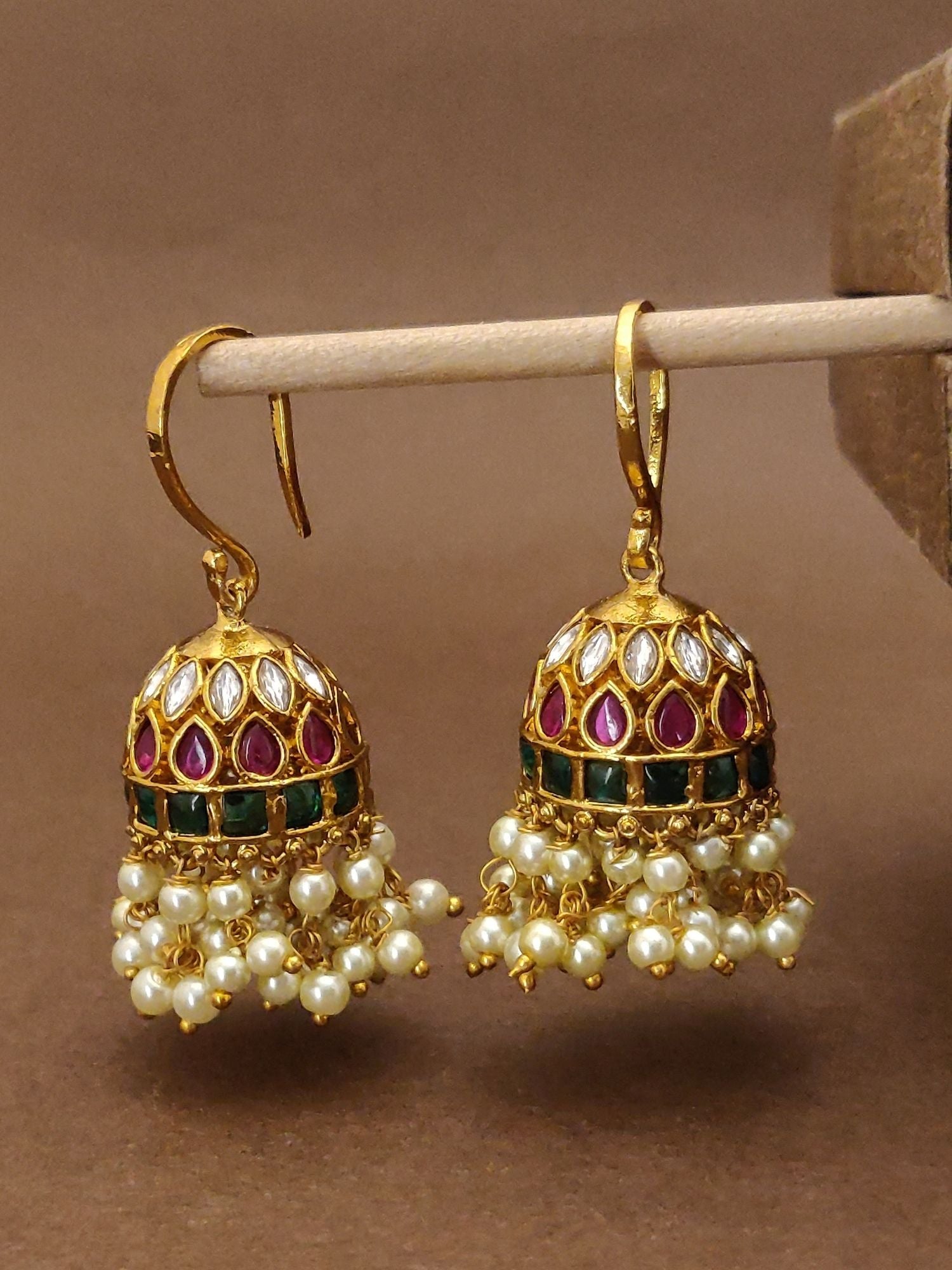 Buy gold finish kempstone hoop earrings with red and green stones and pearl accents by Abdesignsjewellery