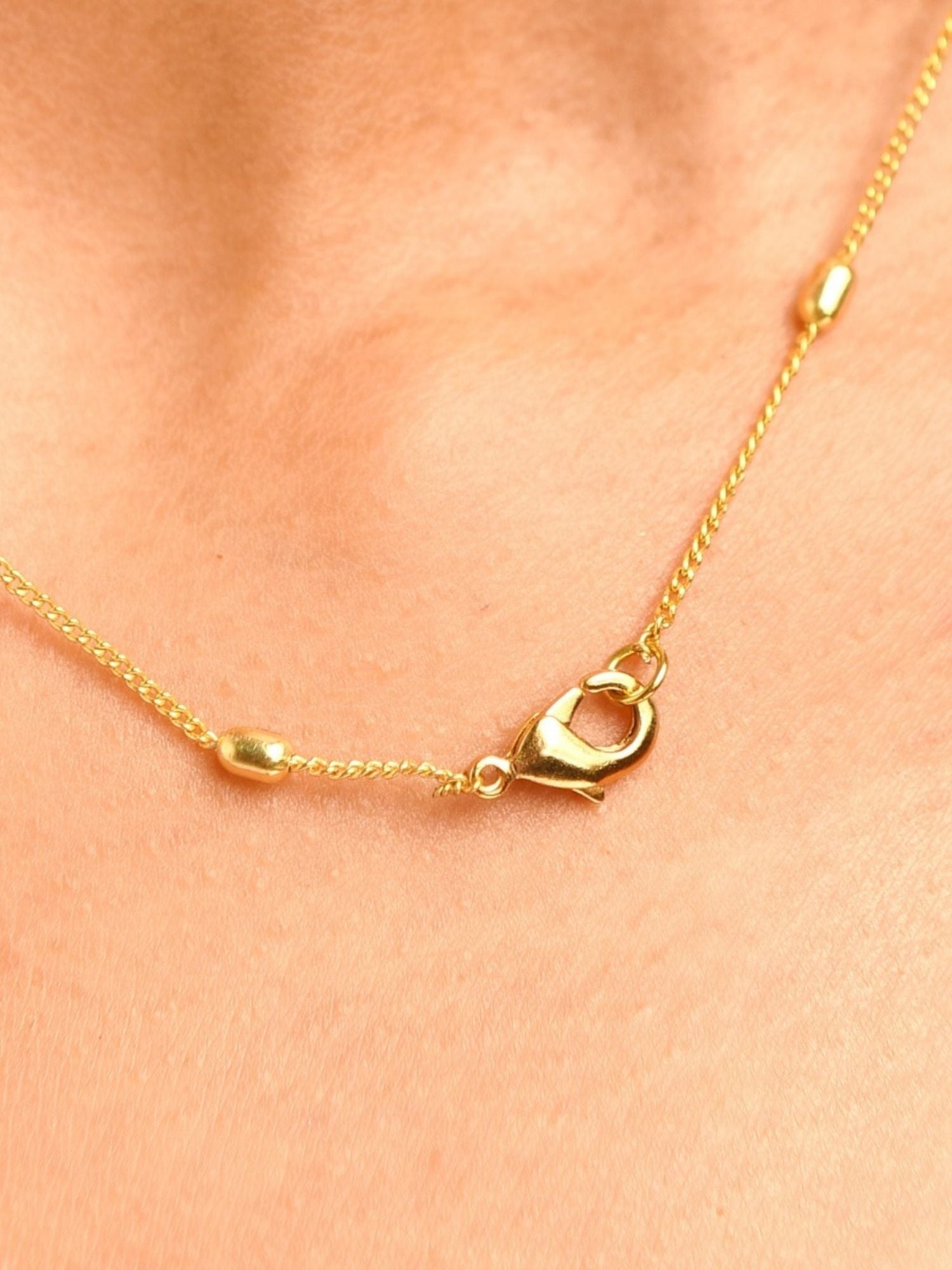 Close-up of Celebrity Style Gold Plated Polki Pendant Chain clasp by Abdesignsjewellery on skin