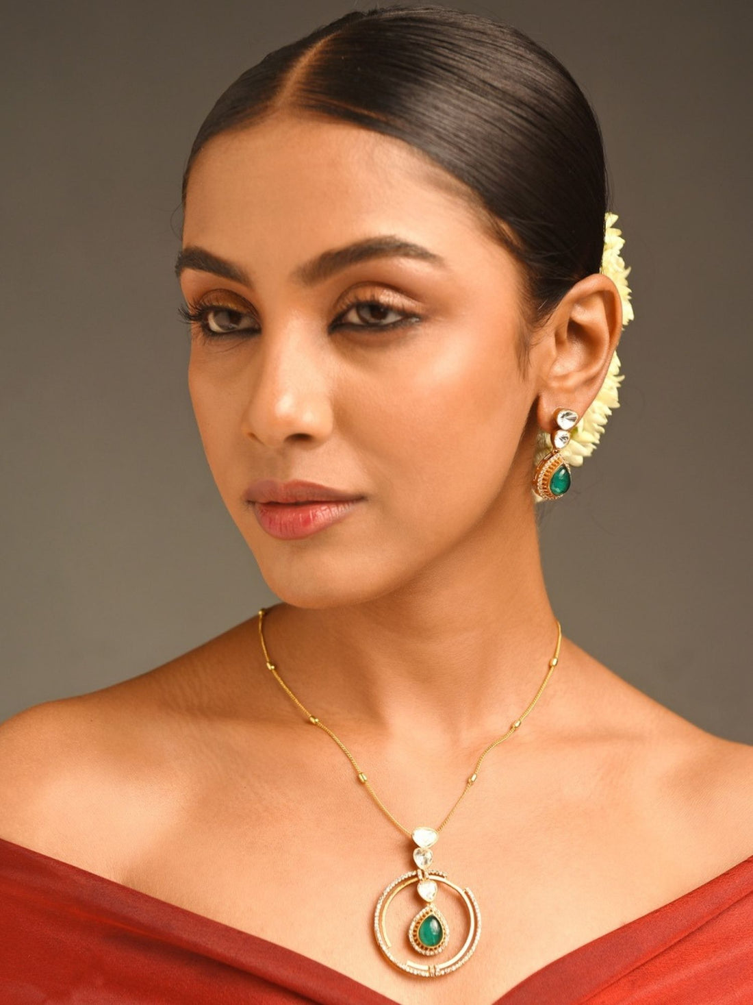Celebrity Style Gold Plated Polki Pendant Chain worn by woman with elegant hairstyle and earrings