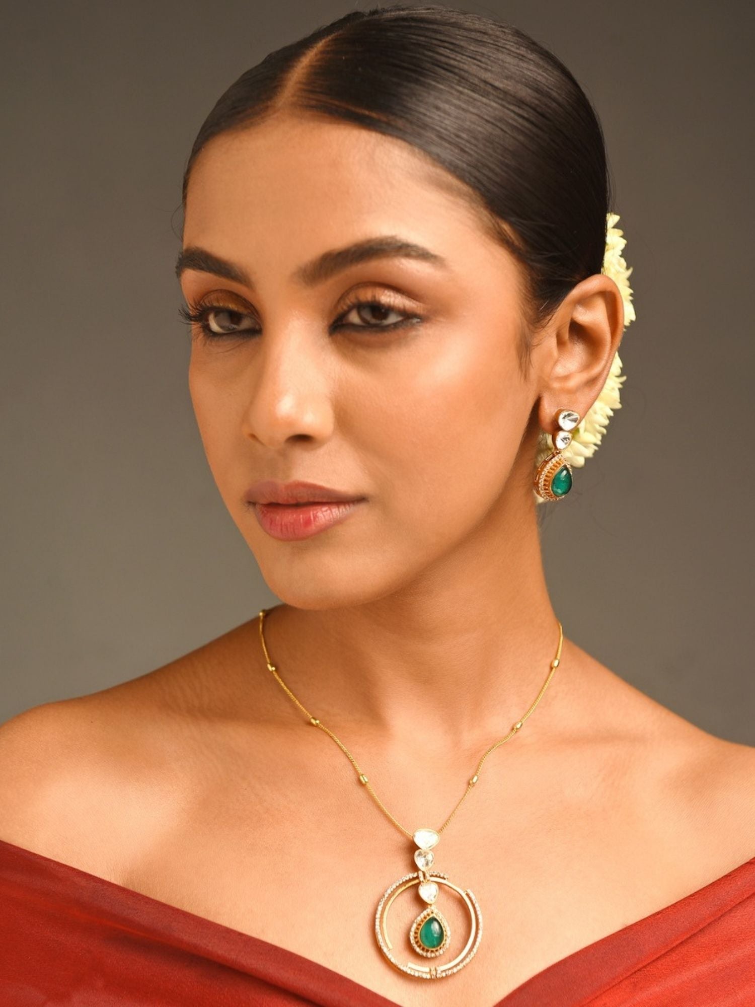 Celebrity Style Gold Plated Polki Pendant Chain worn by woman with elegant hairstyle and earrings