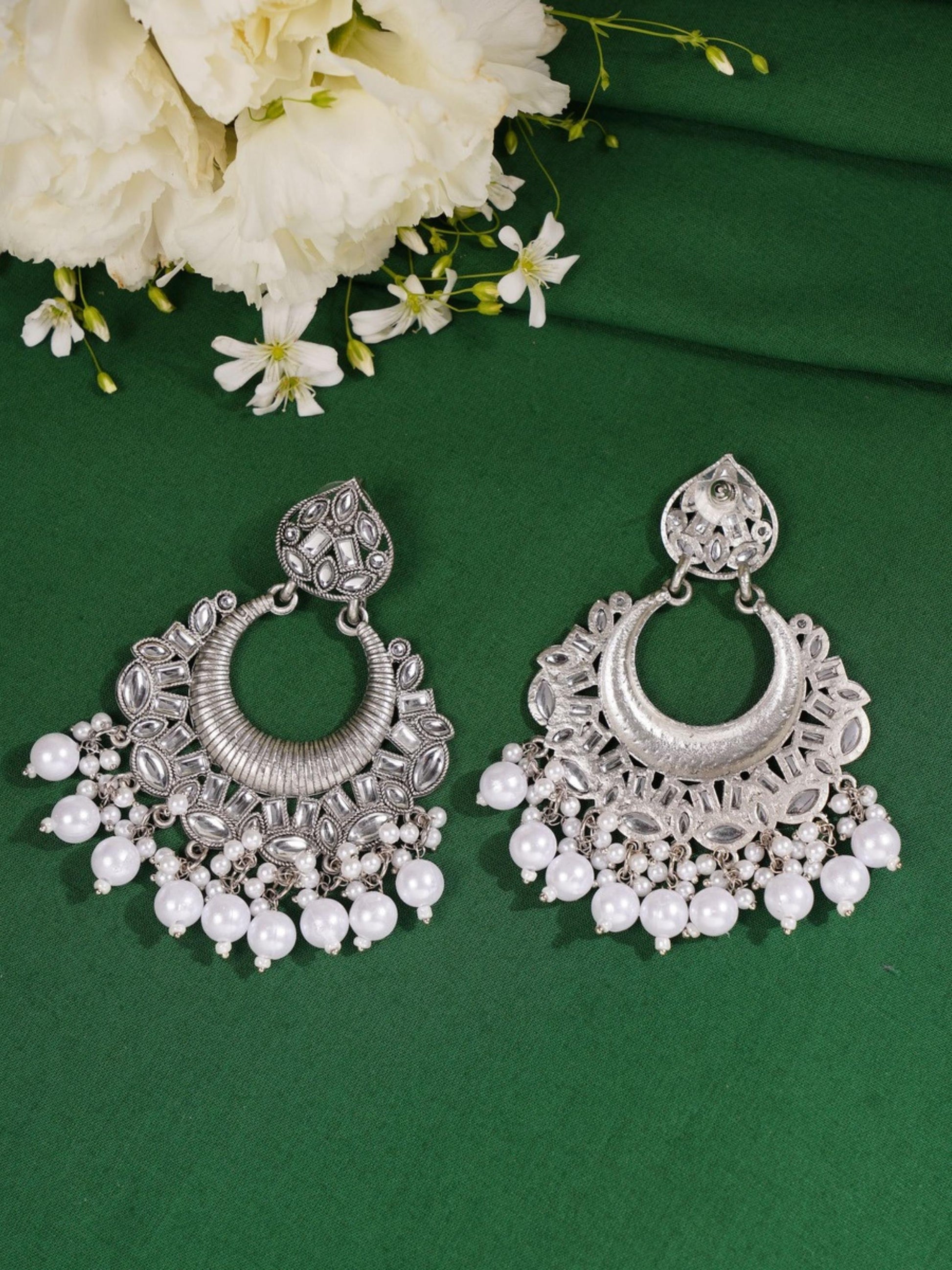 Classic German Silver Plated Chandbali Earring by Abdesignsjewellery with intricate design and pearl accents on green background