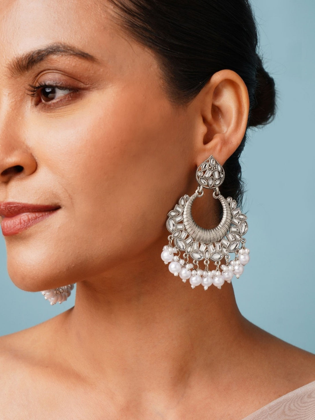 Classic German Silver Plated Chandbali Earring worn by woman showcasing detailed design and pearl accents