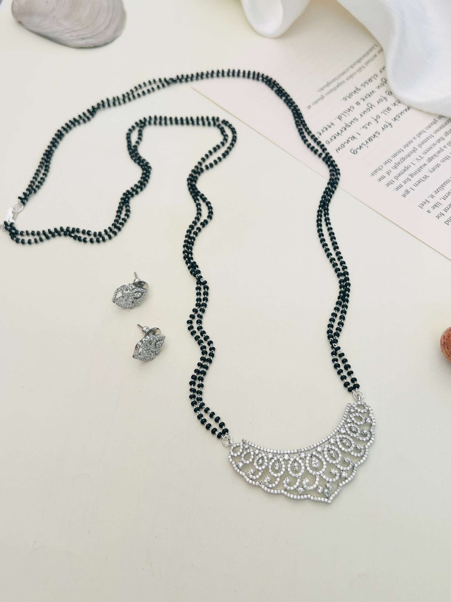 Classic Long Gold Plated American Diamond Mangalsutra Set with intricate pendant and matching earrings by Abdesignsjewellery